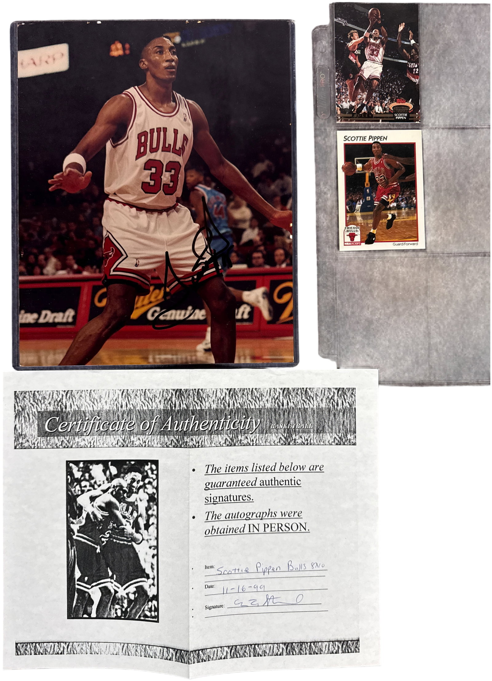 A Collection of Scottie Pippen Chicago Bulls Memorabilia Including Autographed Photograph: This collection features memorabilia related to Chicago Bulls Hall of Famer Scottie Pippen. The primary item is one 8x10 inch color photograph depicting Pippen in a home white Chicago Bulls jersey, nu