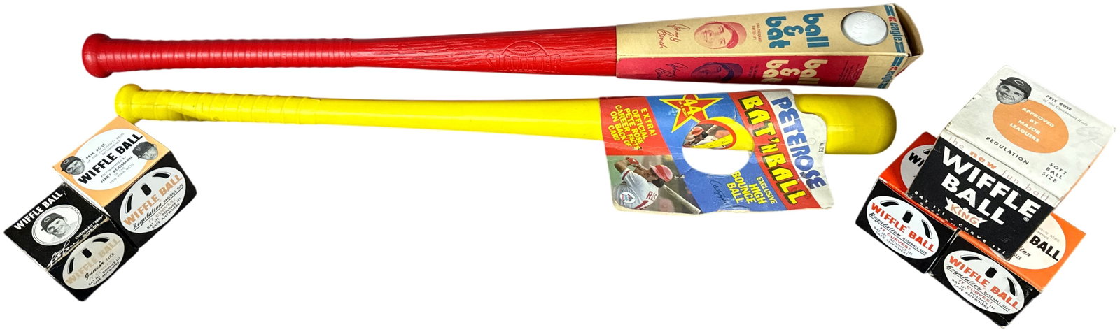 A Group of Vintage Plastic Baseball Bats and Wiffle Ball Equipment featuring Pete Rose and Johnny: A group of vintage plastic baseball memorabilia including bats and original Wiffle Ball packaging. The collection features a red textured plastic bat embossed with the Slammers name and the Eagle logo