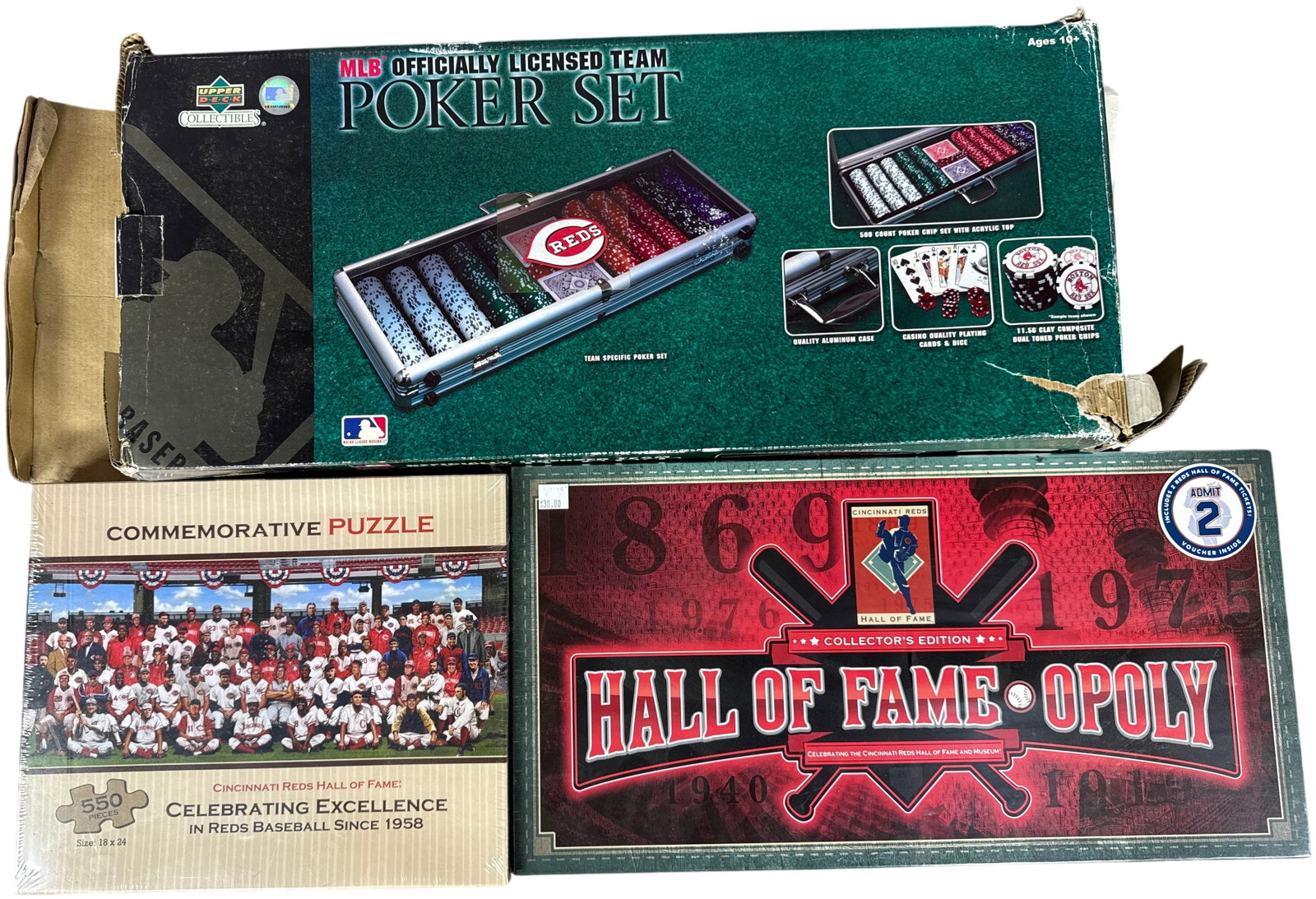 A Trio of Cincinnati Reds Themed Collectibles Including Upper Deck Poker Set, Jigsaw Puzzle, and: This collection features items themed after the Cincinnati Reds baseball team. The first item is an Upper Deck Collectibles MLB Officially Licensed Team Poker Set, which contains 500 dual-toned clay c