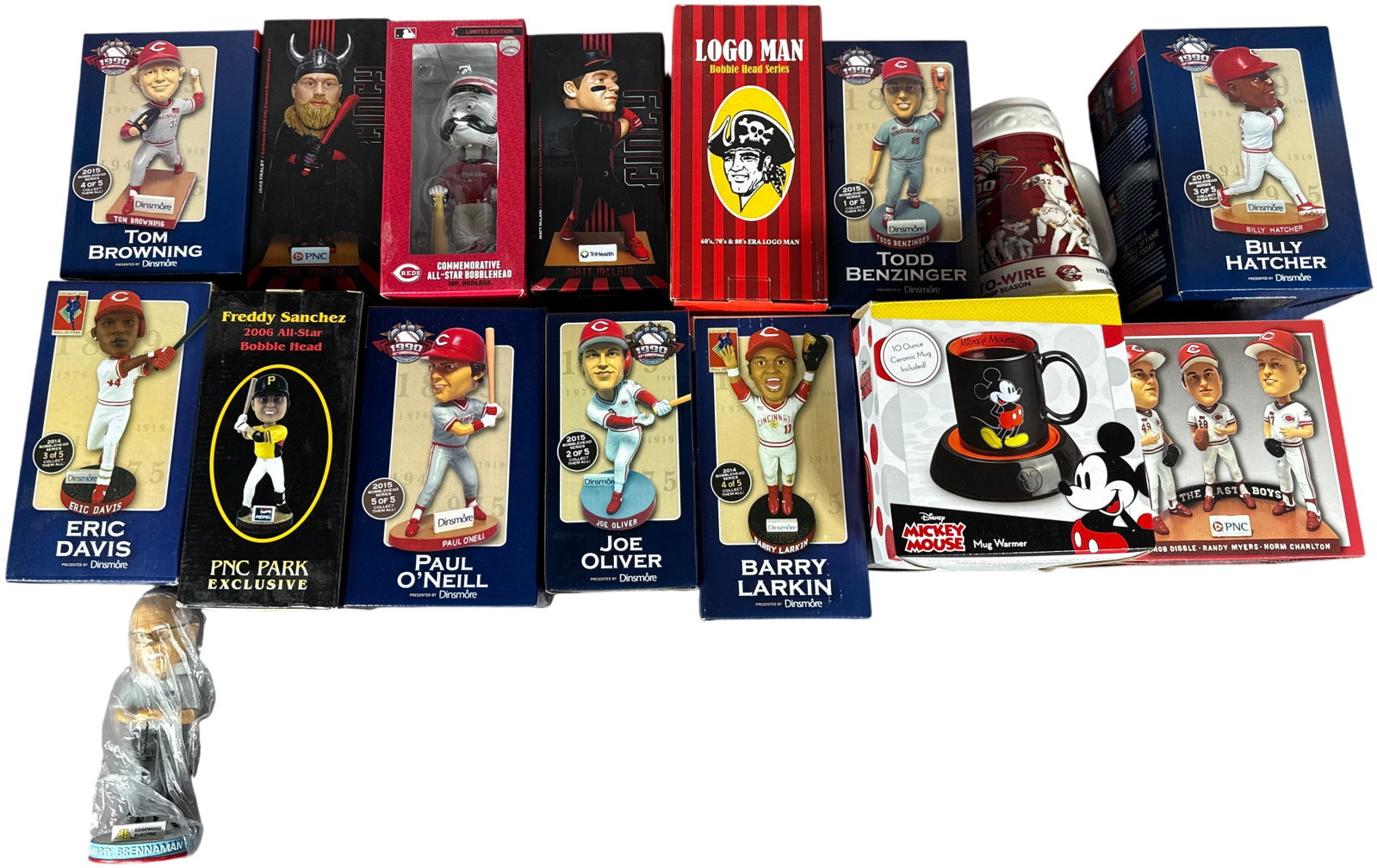 A Collection of Cincinnati Reds and Pittsburgh Pirates Baseball Bobbleheads and Sports Memorabilia: This collection features an assortment of promotional and commemorative baseball memorabilia, primarily focused on the Cincinnati Reds and Pittsburgh Pirates. The group includes several bobbleheads fr
