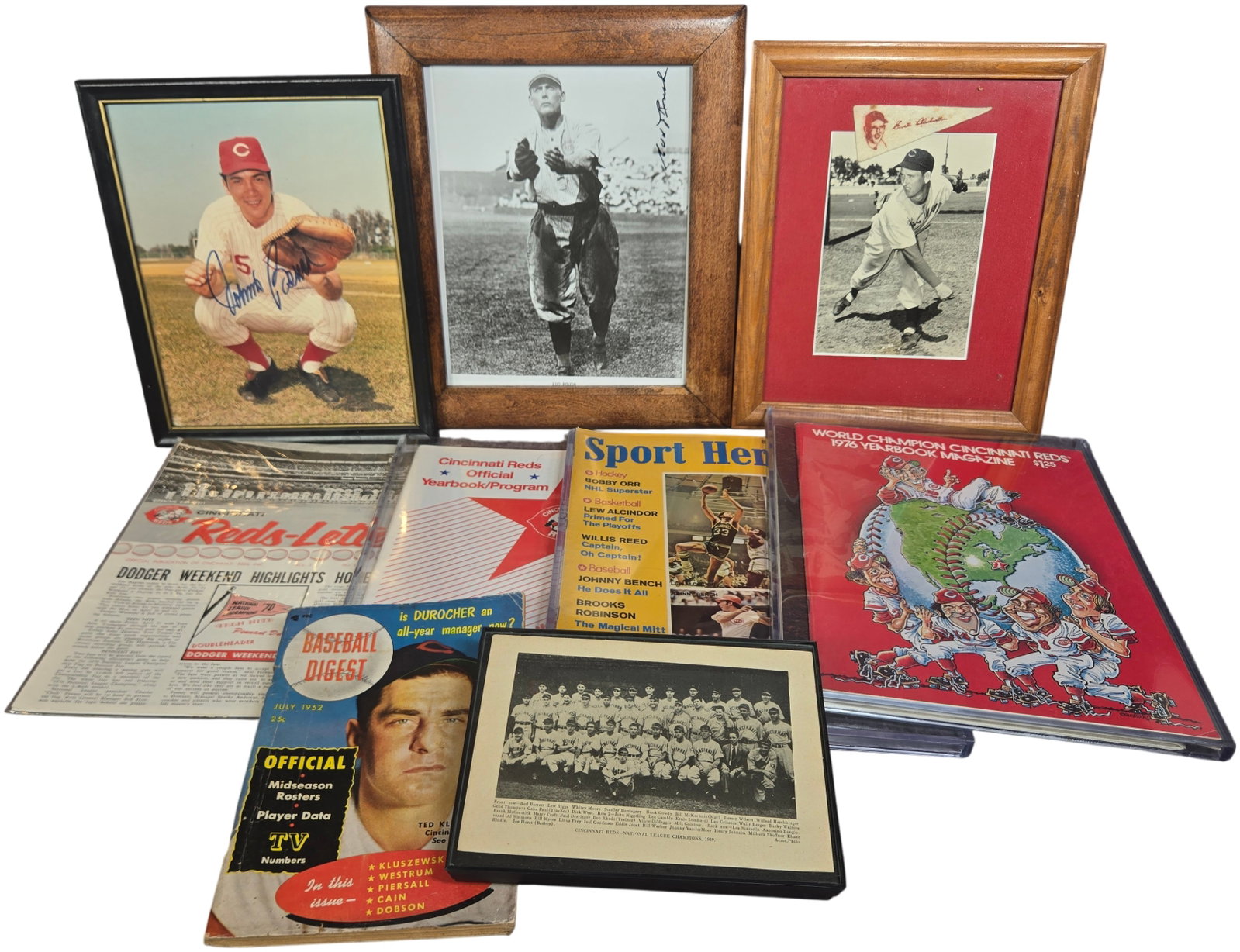 A Collection of Cincinnati Reds and Assorted Sports Memorabilia Featuring Unverified Autographs and: This collection includes several framed photographs and vintage sports periodicals relating to the Cincinnati Reds. The framed pieces feature a color photograph of Johnny Bench with an unverified sign