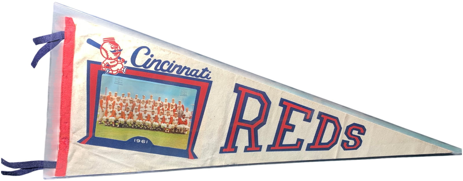 1961 Cincinnati Reds Team Photo Baseball Pennant by Trench Buffalo: A souvenir felt pennant by Trench of Buffalo, New York, commemorating the 1961 Cincinnati Reds baseball team. The off-white felt body features red and blue screen-printed graphics including the team n
