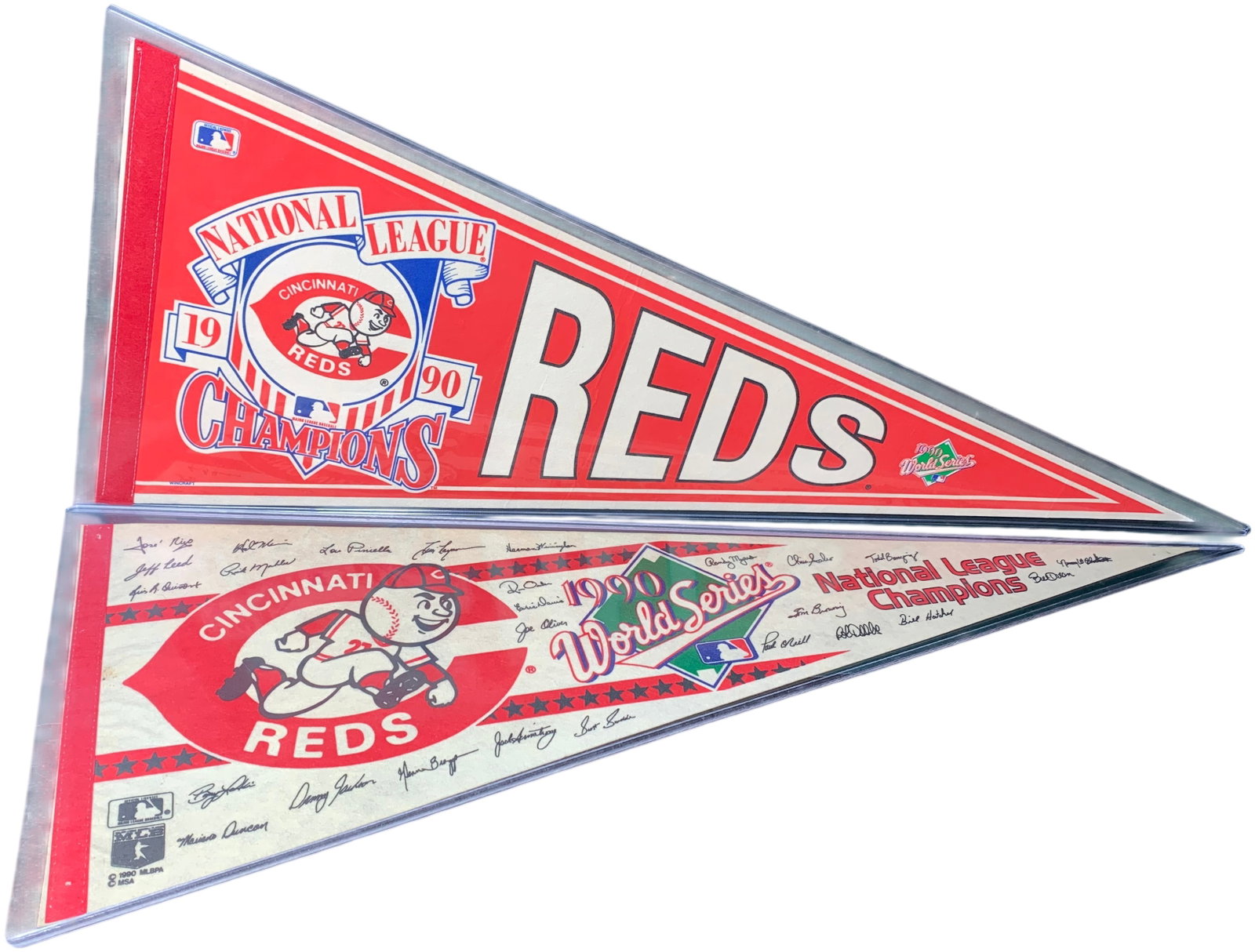 A Pair of Cincinnati Reds 1990 World Series and National League Championship Pennants: This lot features commemorative felt pennants celebrating the Cincinnati Reds 1990 championship season. The first is a red pennant printed with National League Champions 1990 Reds and the 1990 World S