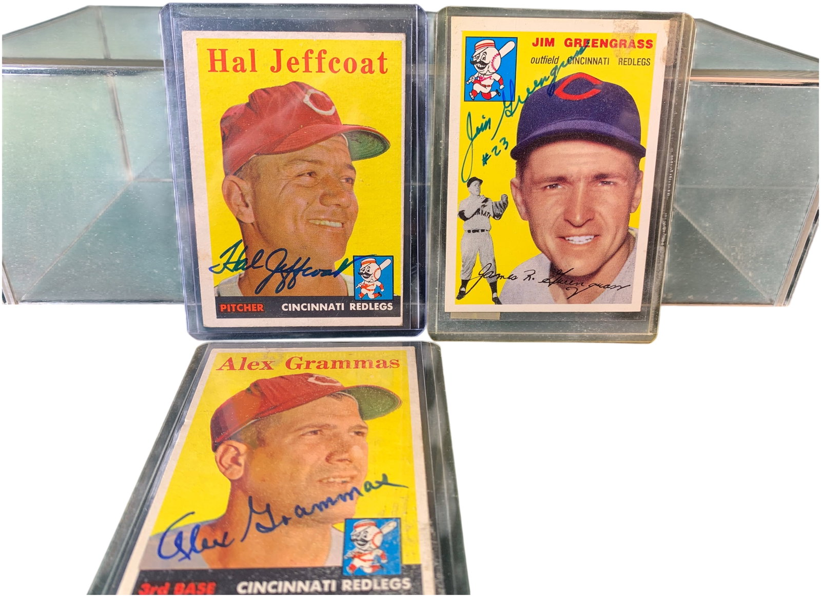 A Trio of Cincinnati Redlegs Autographed Baseball Cards Including 1957 Topps and 1994 Topps Archives: This lot features baseball cards representing the Cincinnati Redlegs, each bearing a hand-signed player autograph. The collection includes vintage 1957 Topps cards and a modern 1994 Topps Archives rep