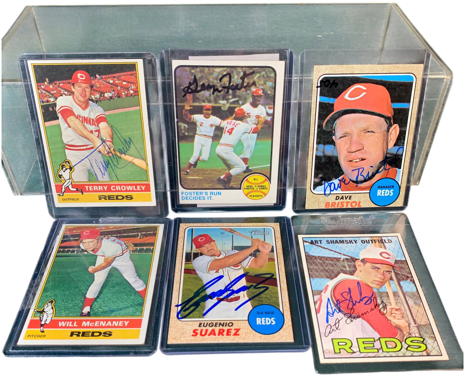 A Collection of Cincinnati Reds Baseball Cards, Topps 1967-2017, Five Autographed: A collection of baseball cards featuring players and personnel from the Cincinnati Reds, manufactured by Topps between 1967 and 2017. The collection is comprised of signed cards and An unsigned card. 