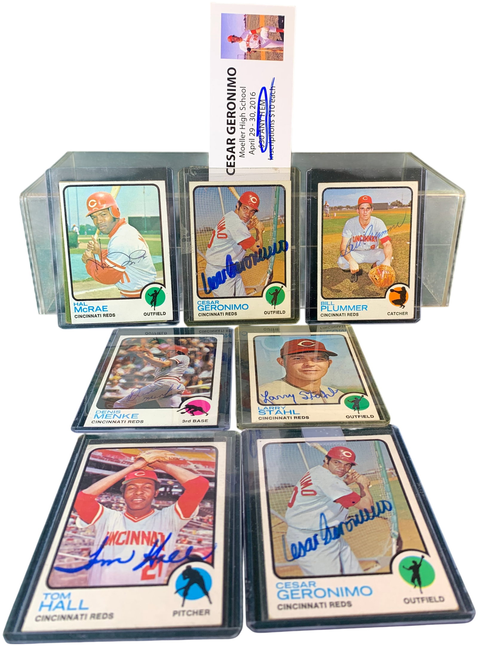 A Collection of Autographed Cincinnati Reds 1971 and 1973 Topps Baseball Cards: A collection of autographed Cincinnati Reds baseball cards featuring players from the Big Red Machine era. The assortment consists of cards from the 1973 Topps set and a card from the 1971 Topps set. 
