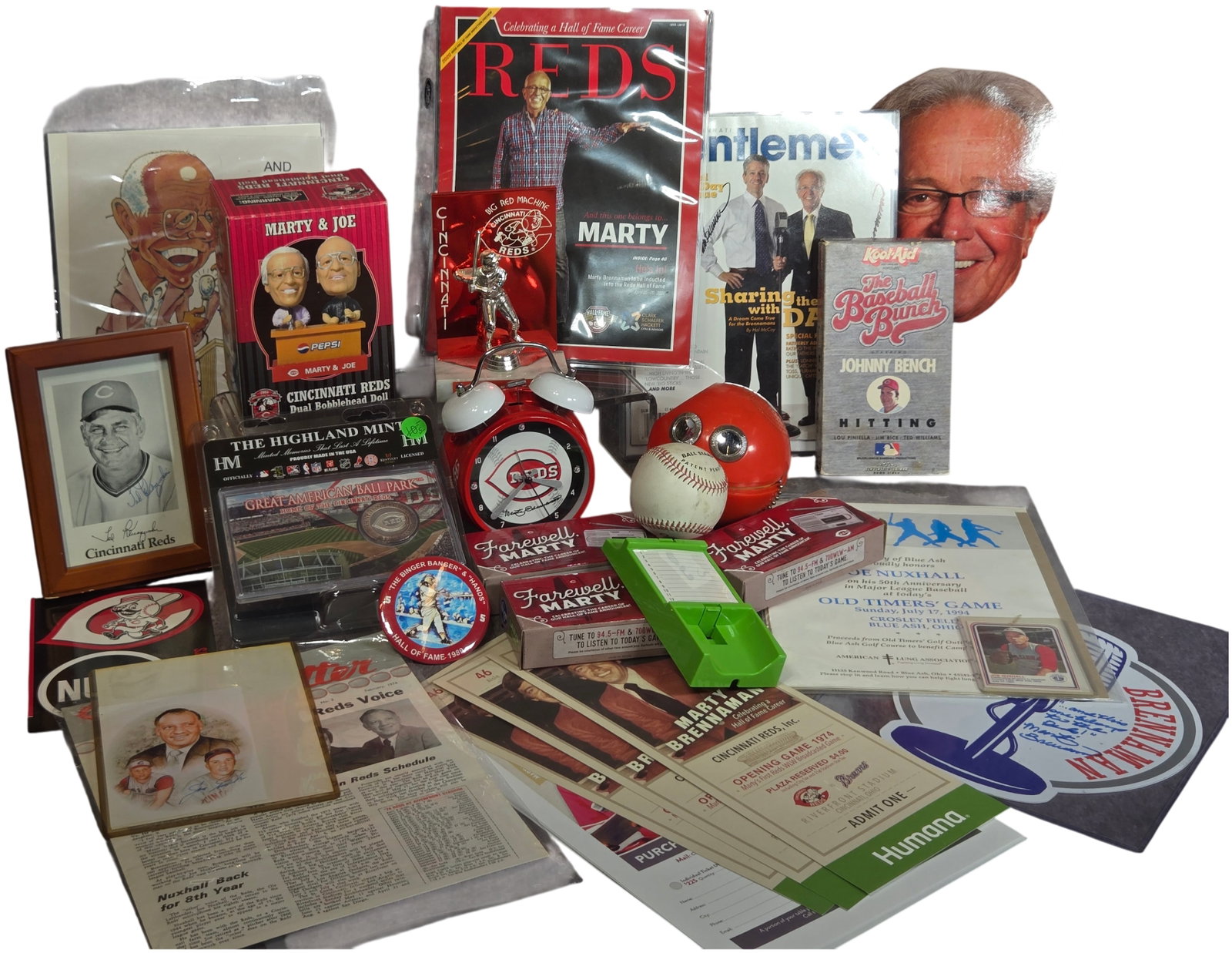 A Collection of Cincinnati Reds Memorabilia Featuring Marty Brennaman and Joe Nuxhall: An extensive assortment of Cincinnati Reds memorabilia primarily focused on Hall of Fame broadcaster Marty Brennaman and player/broadcaster Joe Nuxhall. The collection features a 2003 "Marty & Joe" du