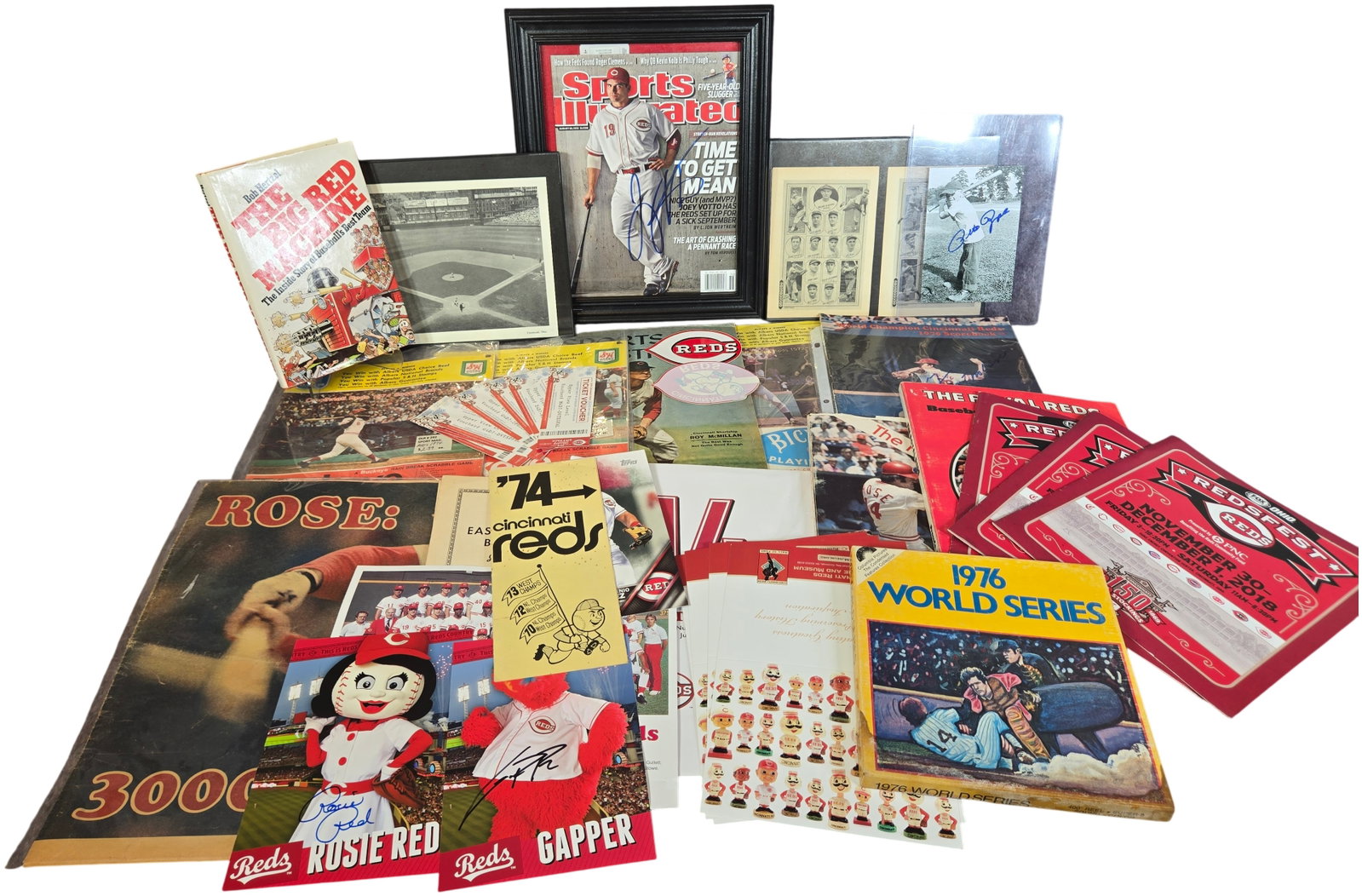 An Assortment of Cincinnati Reds Baseball Memorabilia and Ephemera: This collection includes a diverse variety of vintage and modern Cincinnati Reds baseball memorabilia and printed ephemera. The lot features a framed Sports Illustrated magazine cover from the August 
