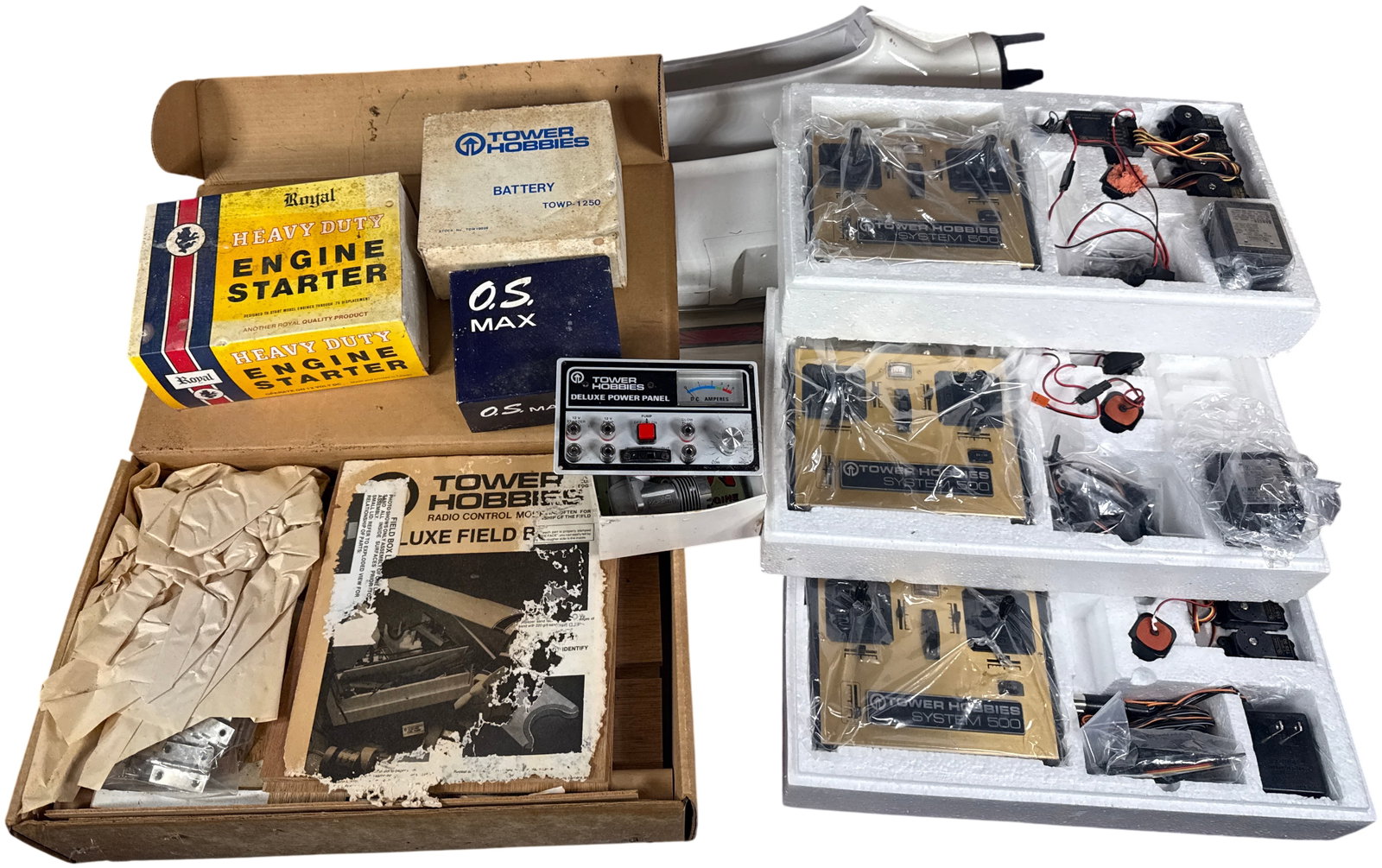 A Collection of Vintage Tower Hobbies, O.S. Max, and Royal Radio-Controlled Airplane Equipment and: This lot comprises an assortment of vintage radio-controlled model aviation components and systems manufactured by Tower Hobbies, O.S. Max, and Royal. The group includes several Tower Hobbies System 5