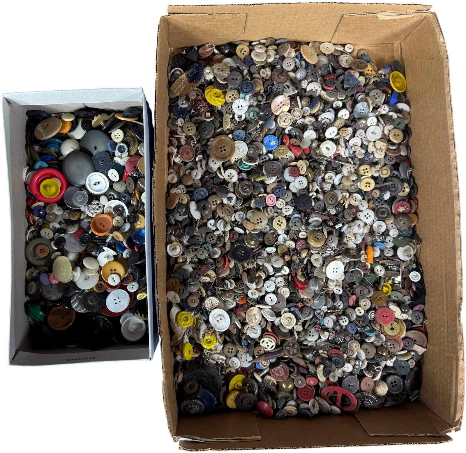 A Collection of Antique and Vintage Buttons with Assorted Hardware: A large and diverse assortment of buttons and related hardware contained within a primary cardboard box and a smaller white rectangular box. The collection includes examples manufactured from a wide v