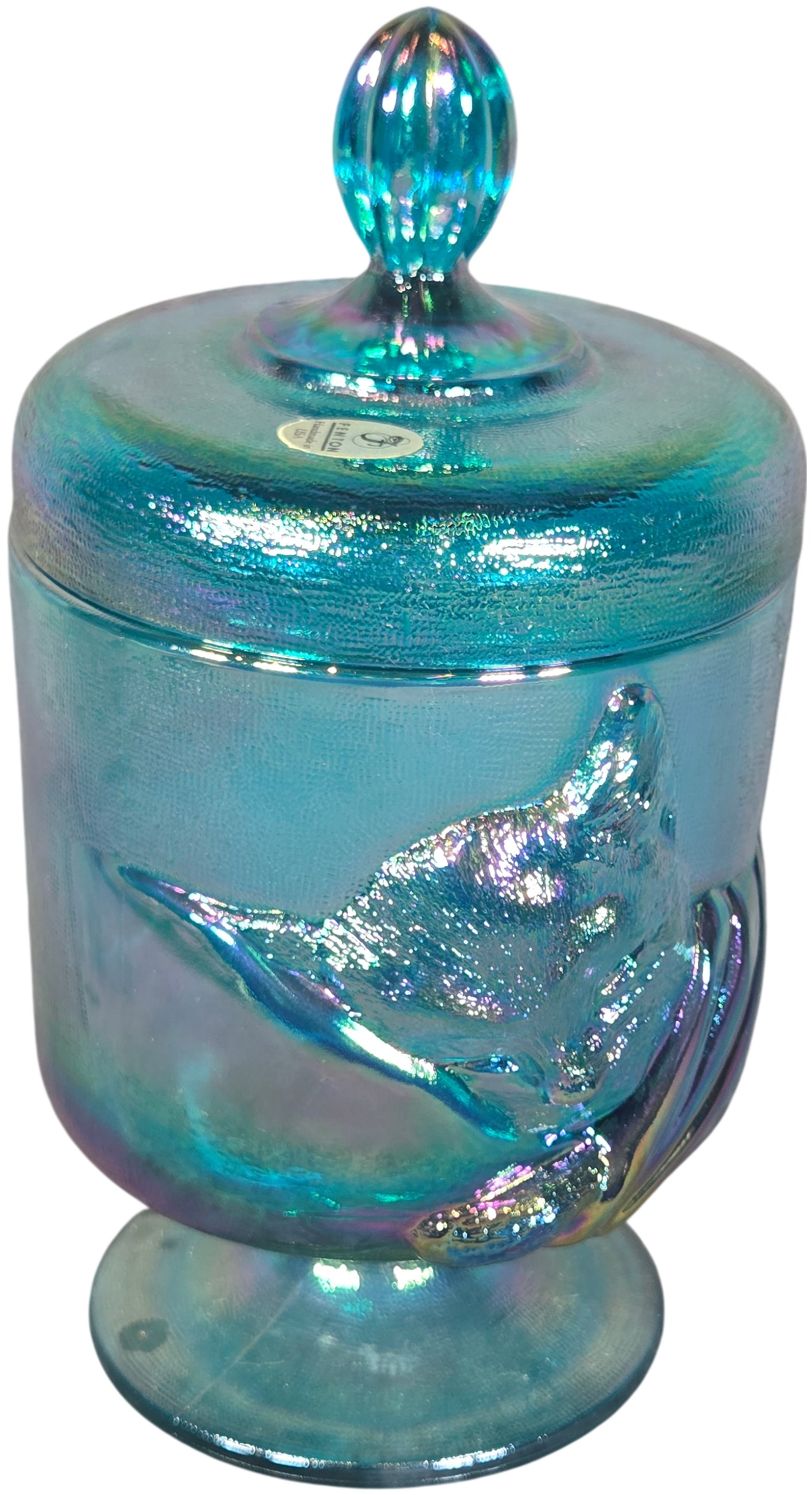 Fenton Sapphire Blue Carnival Glass Chessie Cat Lidded Pedestal Jar, 1988: This is a Fenton Art Glass lidded pedestal jar, specifically the Chessie model produced in 1988. The piece is crafted from sapphire blue carnival glass, featuring a vibrant multi-color iridescent fini