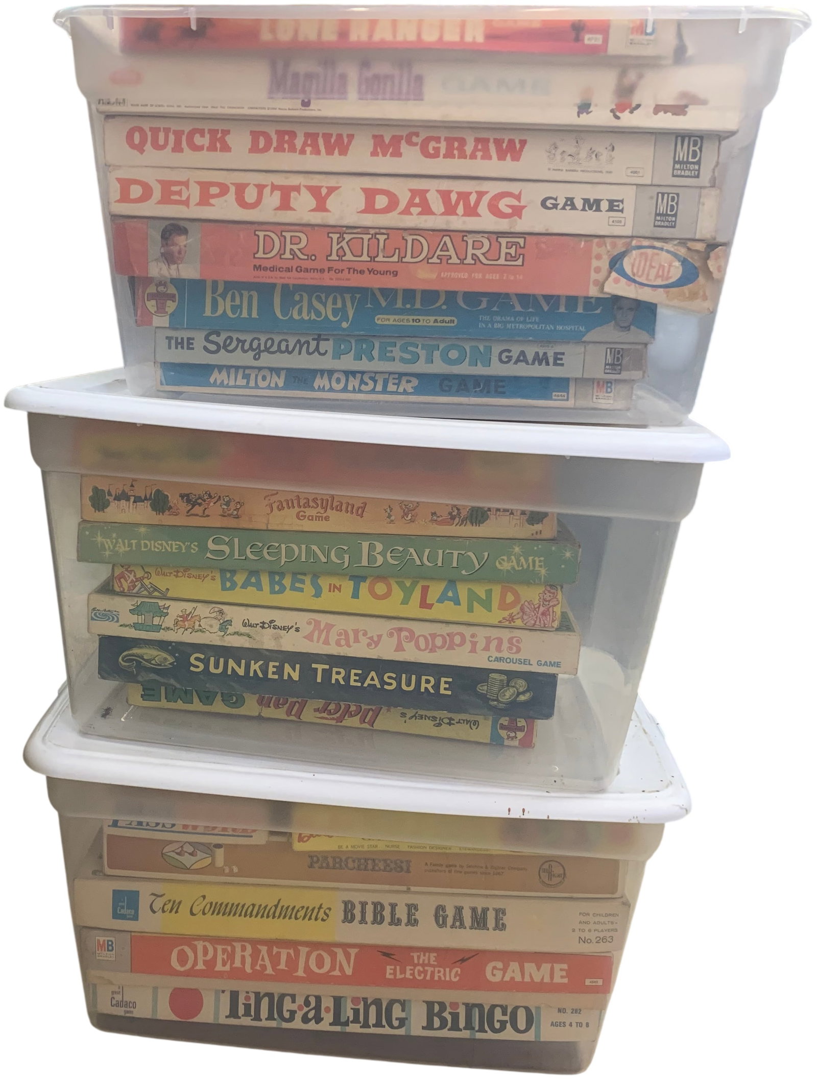 Collection of Vintage Board Games in Storage Bins: A collection of vintage board games by various makers including Milton Bradley and Mattel, featuring titles such as Operation, Parcheesi, and Disney-themed games housed in three plastic storage contai