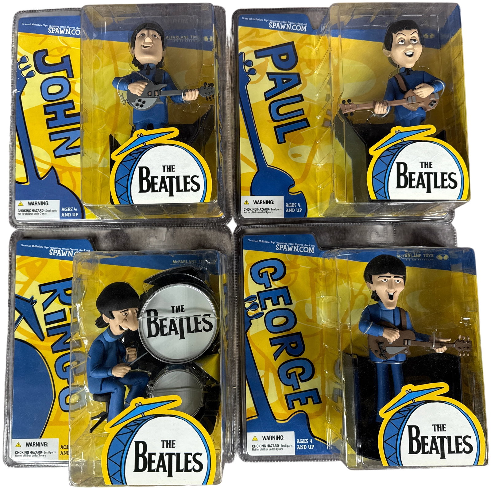 A Set of McFarlane Toys The Beatles Cartoon Series Action Figures: A set of collectible action figures manufactured by McFarlane Toys (TMP International, Inc.), released in 2004. This collection depicts the members of The Beatles as they appeared in the 1965 King Fea