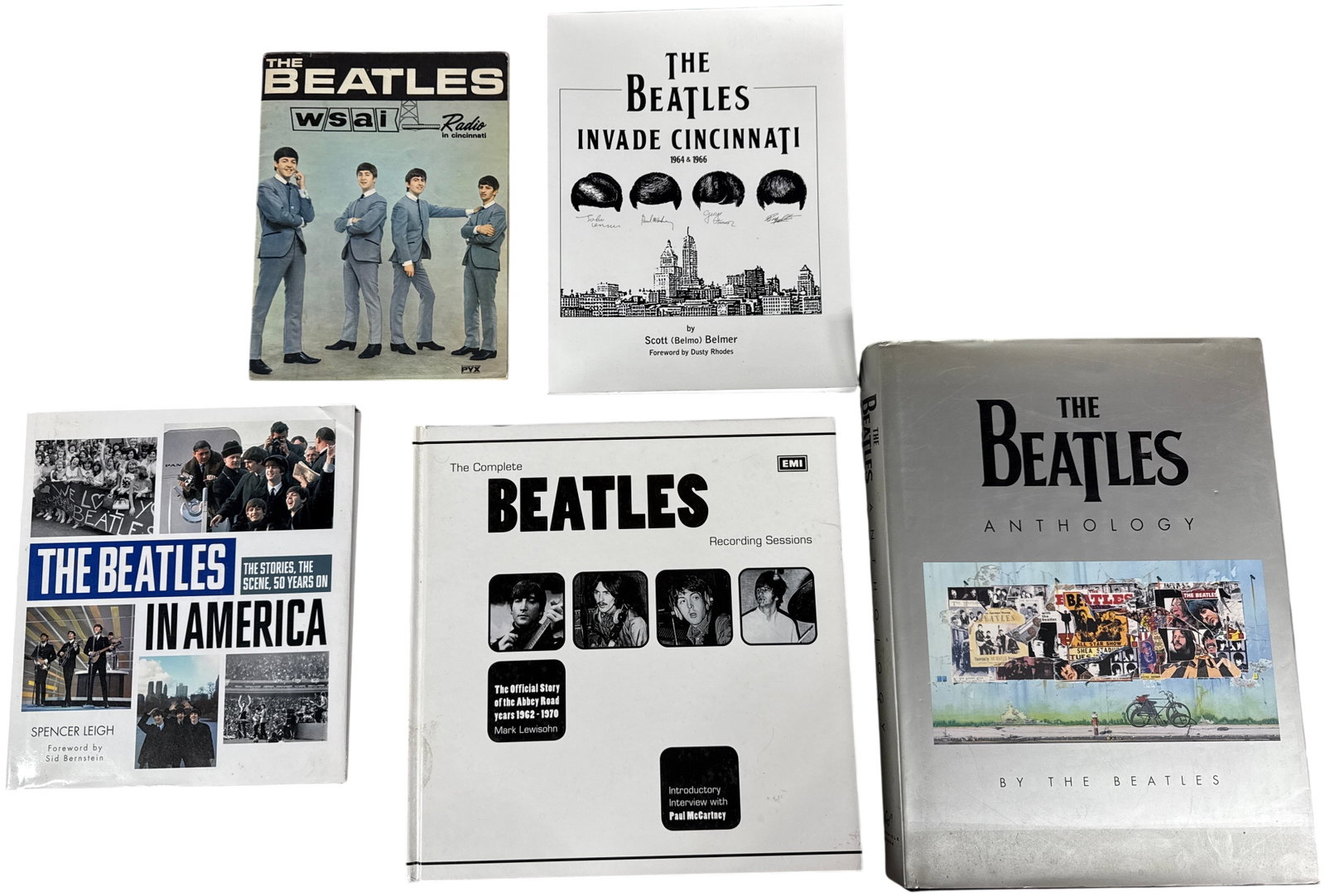 A Collection of Books and Ephemera Relating to The Beatles Including Anthology and Signed Volume: A collection of volumes and ephemera documenting the history and career of The Beatles. The assortment includes a vintage 1964 promotional booklet titled The Beatles: WSAI Radio in Cincinnati, publish