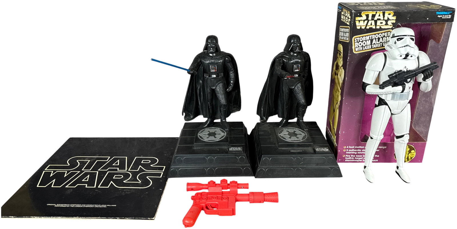 A Collection of Star Wars Collectibles Including Tiger Electronics Room Alarms and a 1977 Soundtrack: This lot features a collection of Star Wars themed items consisting of electronic room alarms produced in the late 1990s and an original motion picture soundtrack record. Included is a Tiger Electroni