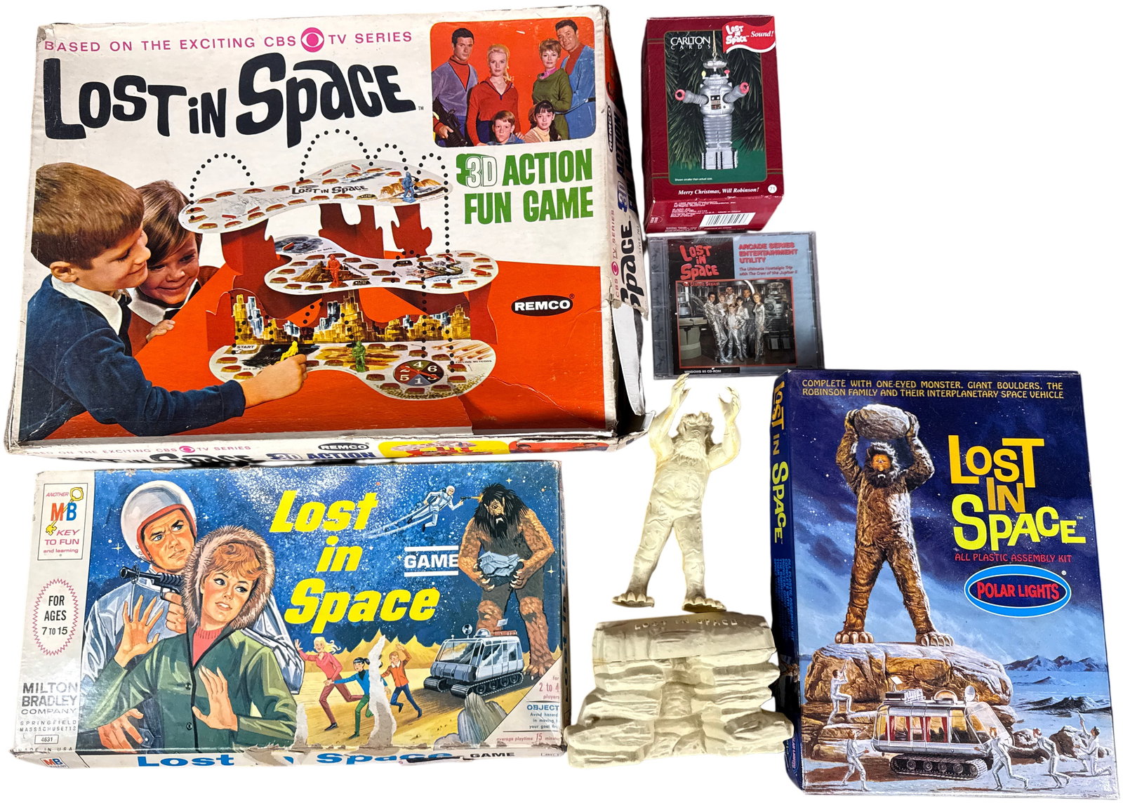 A Collection of Lost in Space Television Series Games Model Kit and Multimedia Items: This collection of memorabilia based on the Lost in Space television series includes various games, a model kit, and multimedia software produced between 1965 and 1998. The group features the 3D Actio