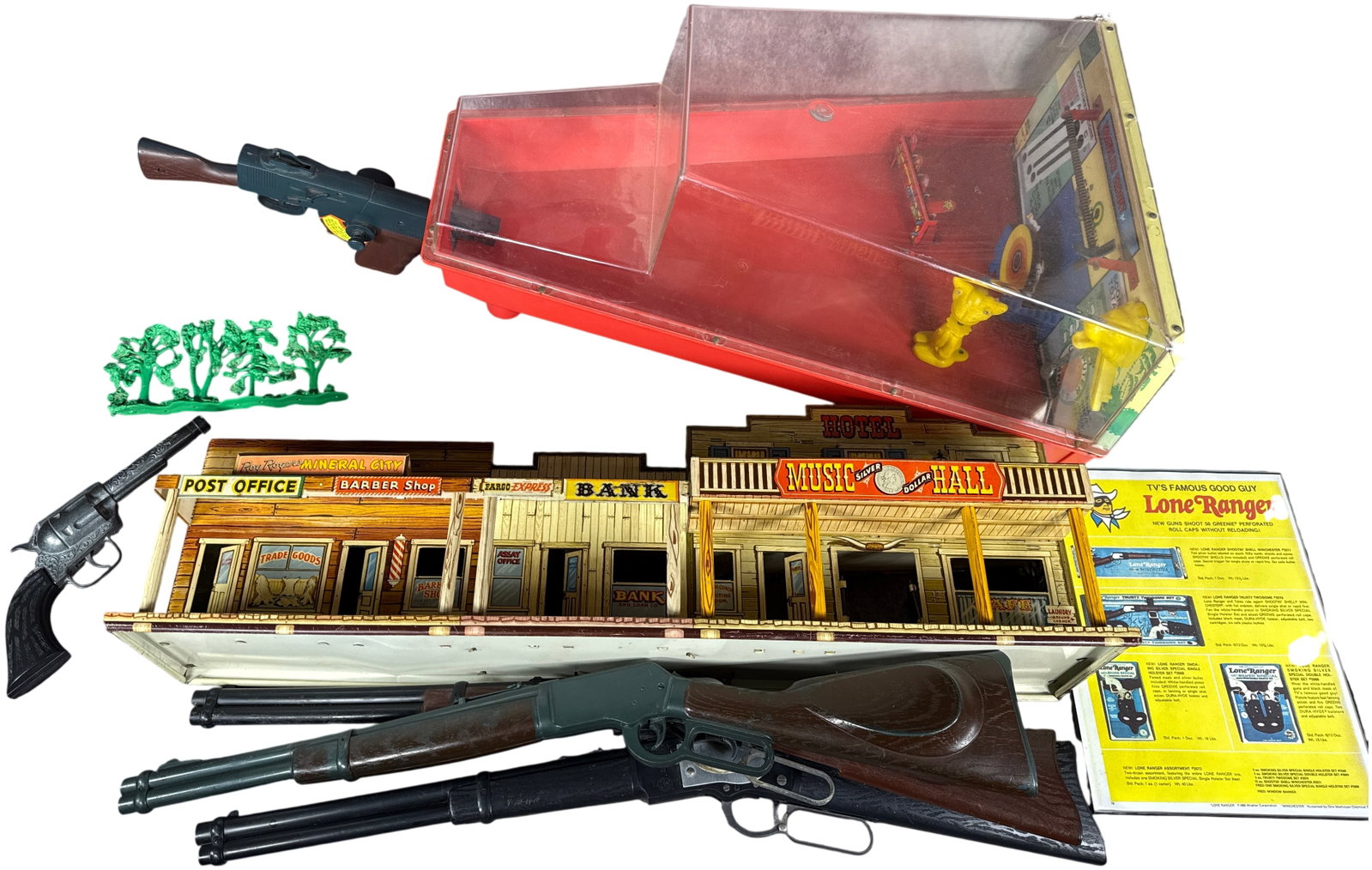 A Collection of Vintage Western Toys Including Marx Electro Shot Shooting Gallery and Roy Rogers: This collection features a variety of mid-century toys centered on Western and shooting gallery themes. The lot includes a Marx Electro Shot battery-operated shooting gallery consisting of a red plast
