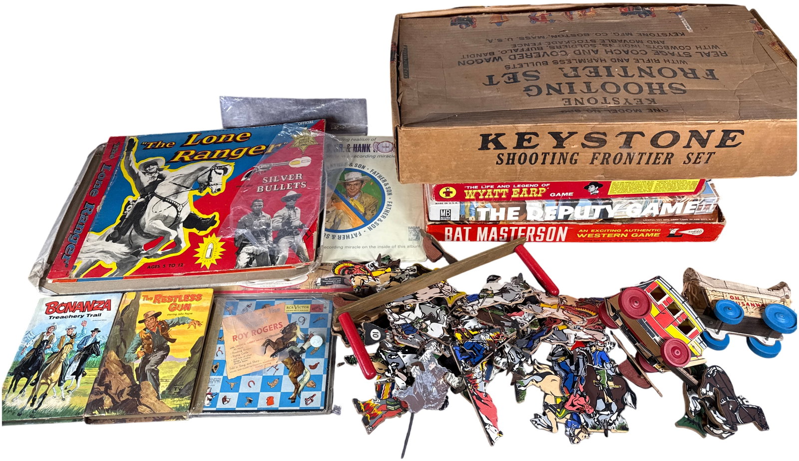 A Collection of Vintage Western Themed Games, Toys, and Media: An assortment of vintage mid-century Western-themed toys, board games, and media featuring popular television and music personalities. The cornerstone of the collection is a Keystone Shooting Frontier