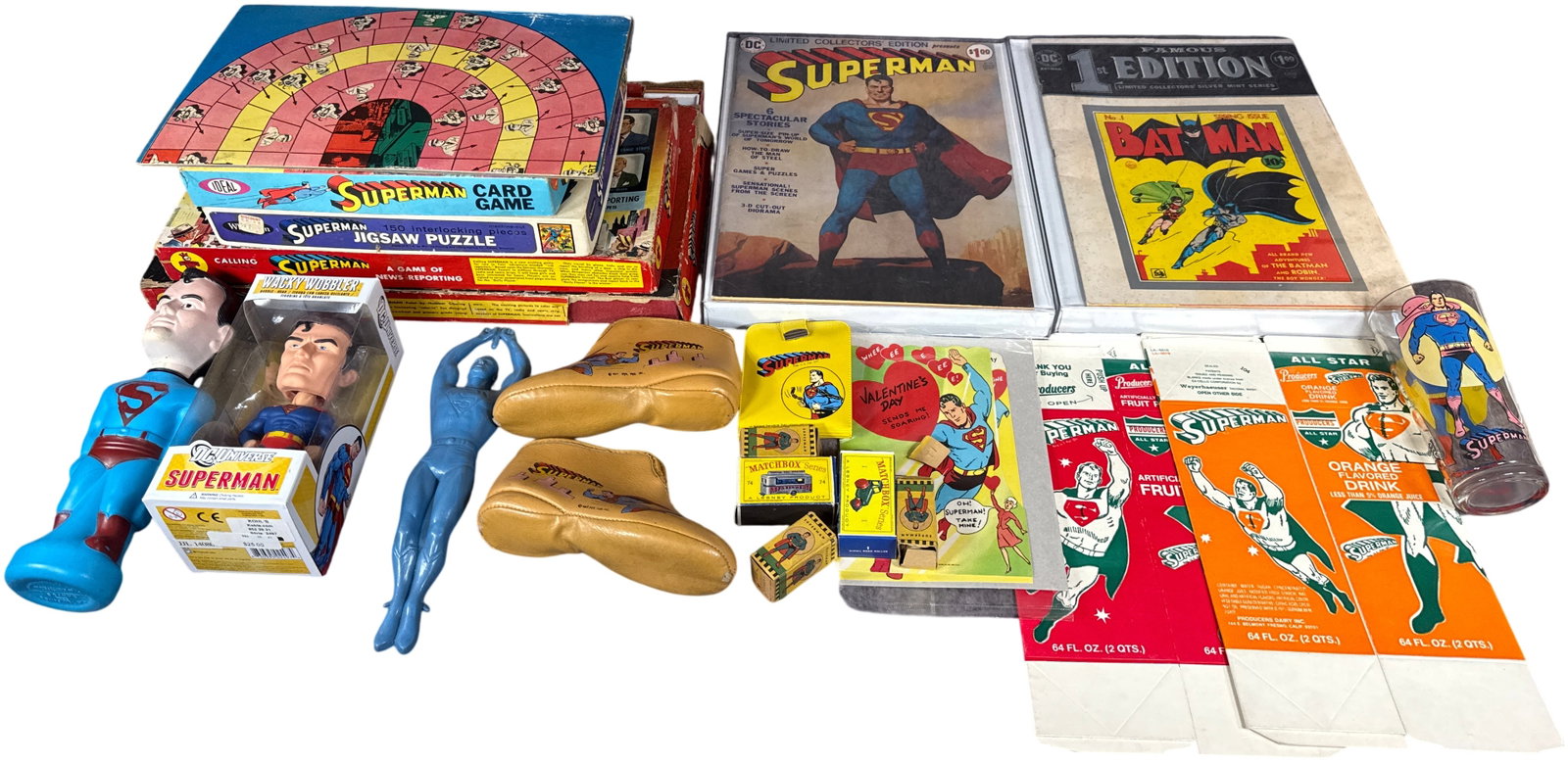 A Collection of Vintage Superman and DC Comics Toys, Games, and Ephemera: This assortment of vintage DC Comics collectibles is focused primarily on Superman merchandise dating from the 1950s to the mid-1970s. Key items include a 1954 Calling Superman Game of News Reporting 