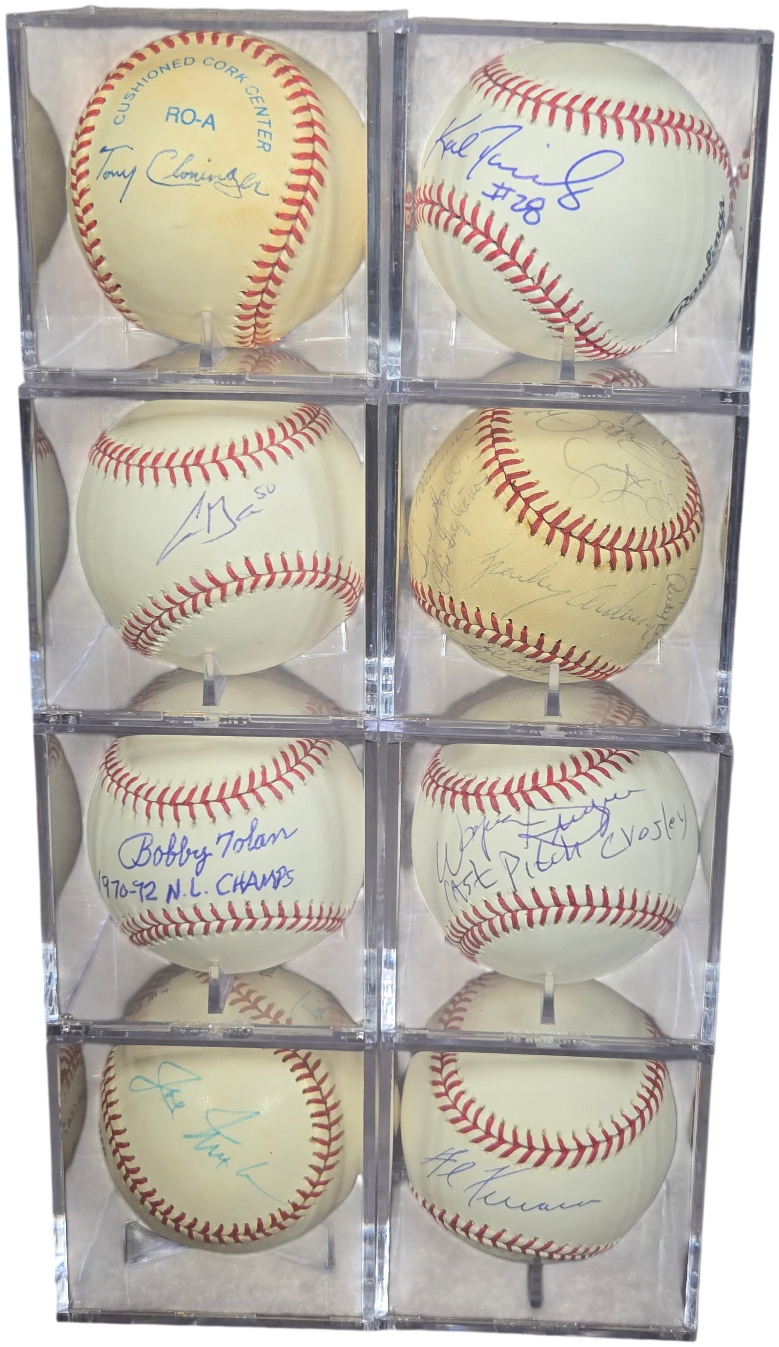 A Group of Autographed Baseballs Primarily Featuring Cincinnati Reds Big Red Machine Era Players: This collection consists of autographed baseballs, the majority of which feature players associated with the Cincinnati Reds Big Red Machine era of the 1970s. The baseballs are housed in individual cl