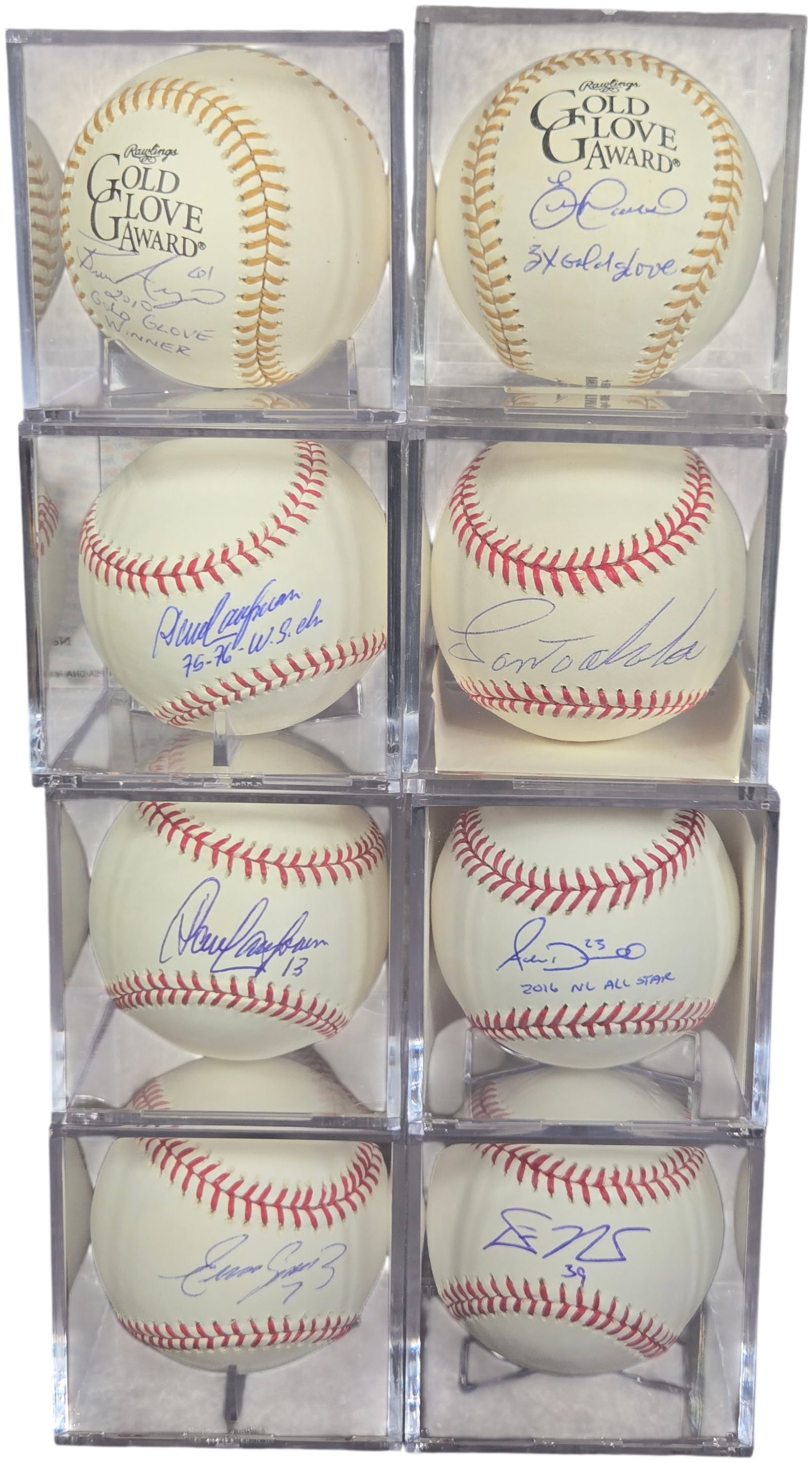 A Collection of Autographed Cincinnati Reds Baseballs Including Brandon Phillips and Paul O'Neill: This collection consists of autographed baseballs, predominantly featuring notable players from the Cincinnati Reds franchise. The lot includes Rawlings Gold Glove Award commemorative baseballs signed