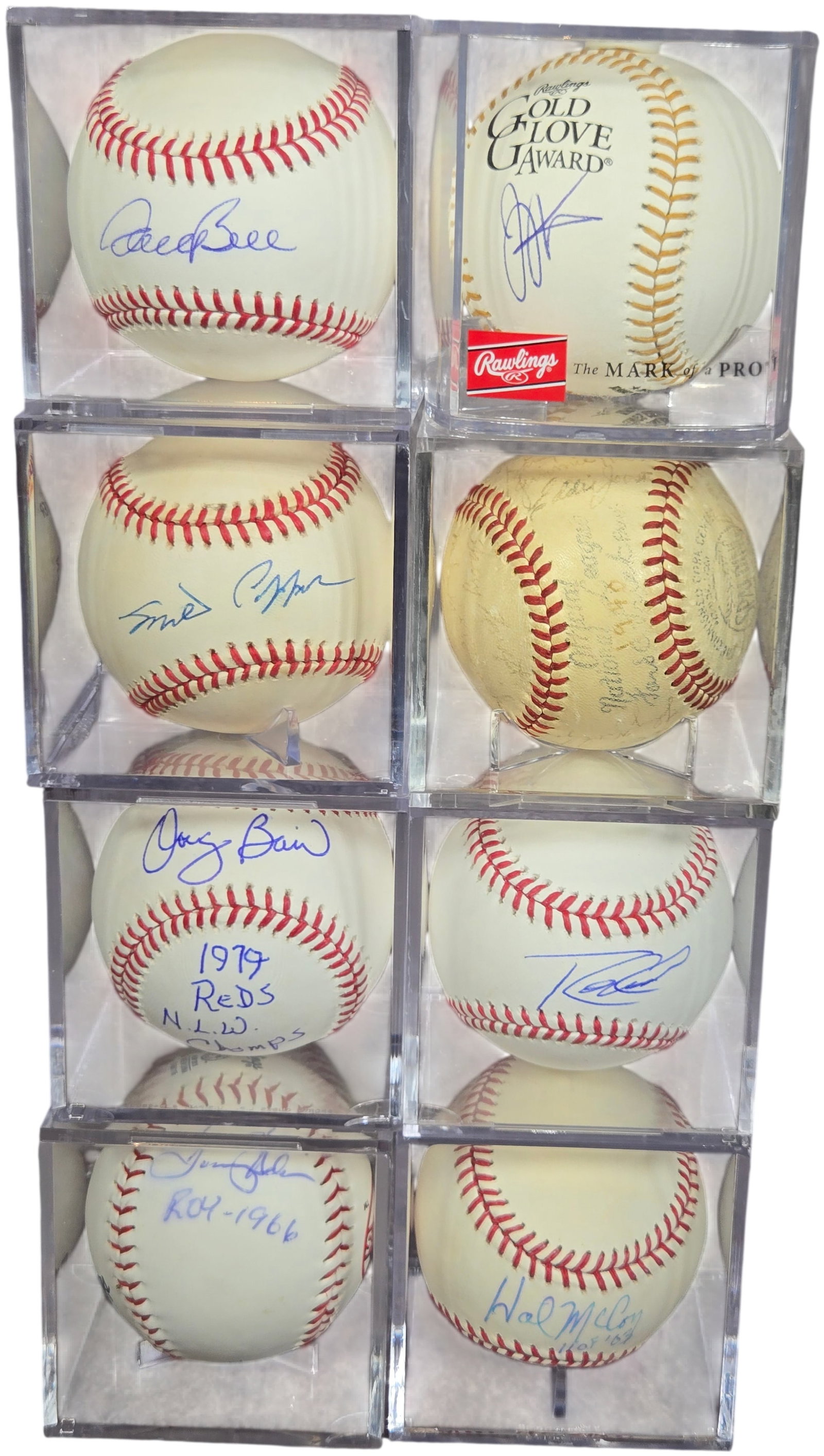A Collection of Autographed and Commemorative Cincinnati Reds and MLB Baseballs: A collection of autographed and commemorative baseballs, primarily featuring players and figures associated with the Cincinnati Reds organization. The group includes a Tommy Helms signed baseball