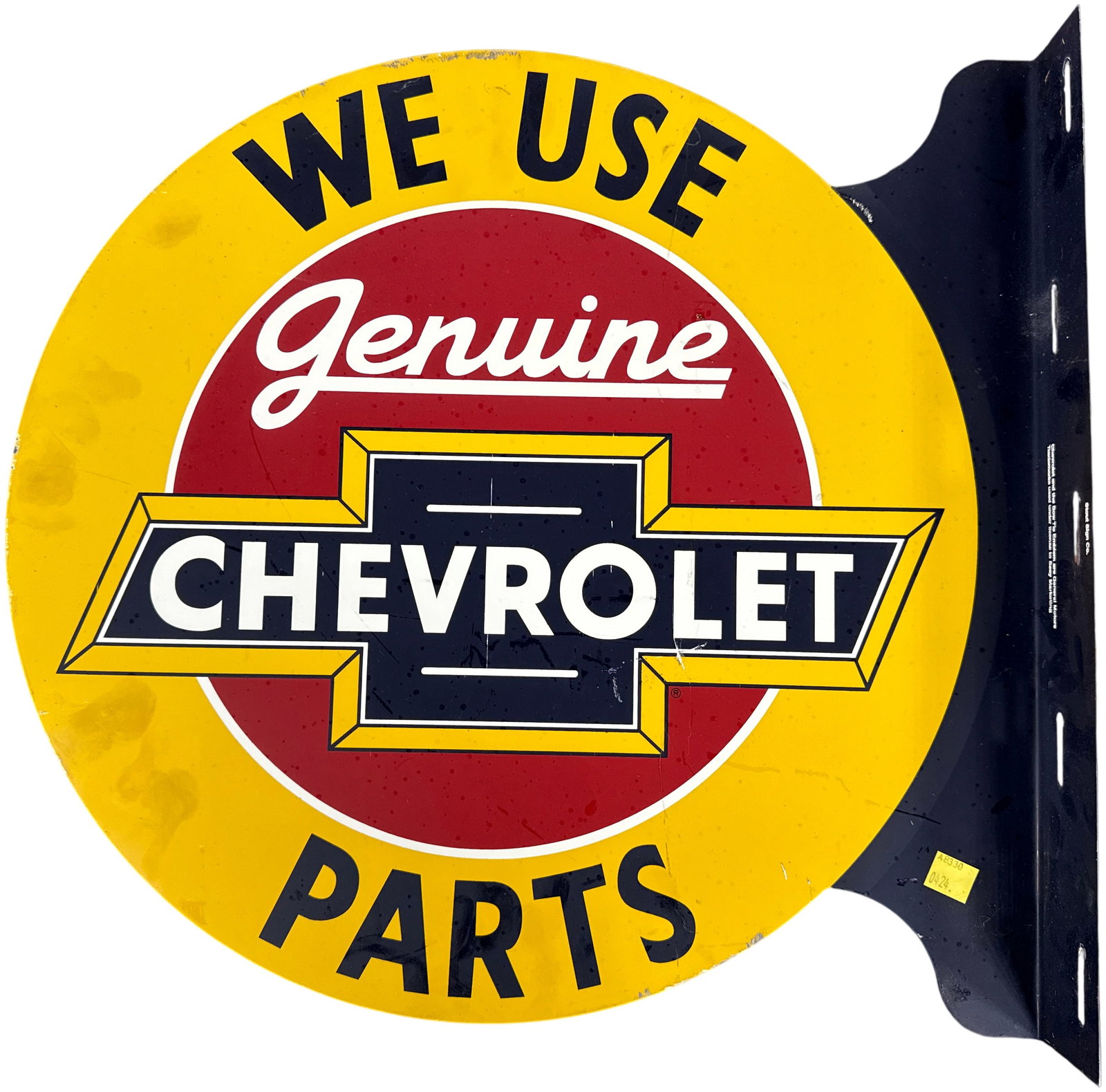 Licensed Chevrolet Genuine Parts Double-Sided Metal Flange Sign: A double-sided metal flange sign featuring the Chevrolet Genuine Parts branding, produced by Stout Sign Co. As a licensed contemporary reproduction for Seay Marketing. The sign is designed for