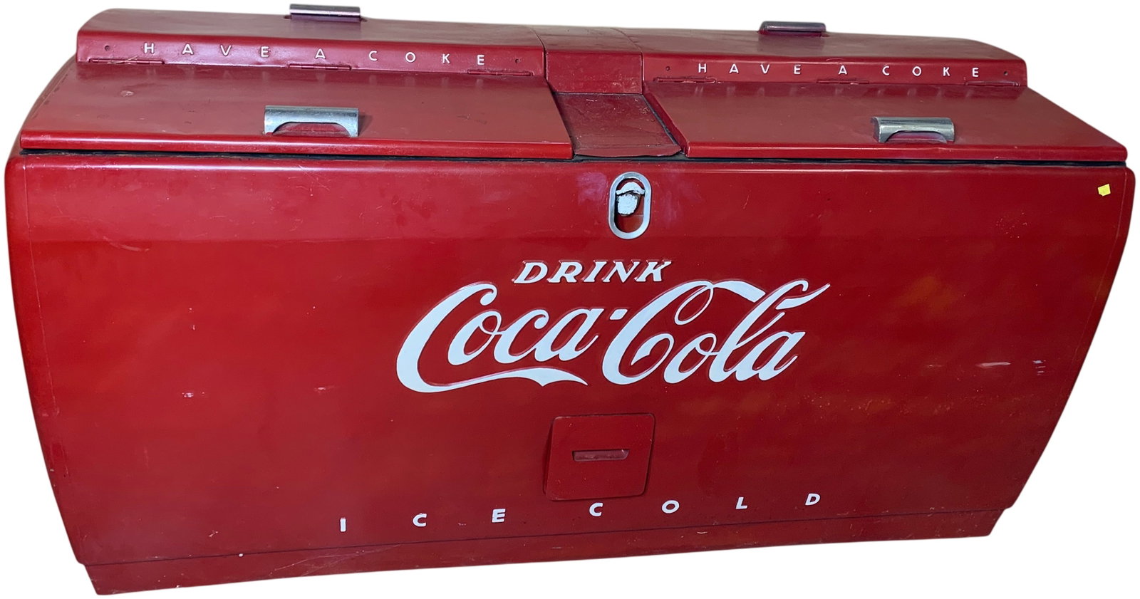 Vintage Westinghouse Model WD-20 Coca-Cola Beverage Chest Cooler: A mid-20th-century metal chest-style beverage cooler, attributed to Westinghouse as model WD-20. The cooler is finished in a red paint scheme with white promotional text. It features a horizontal, rec