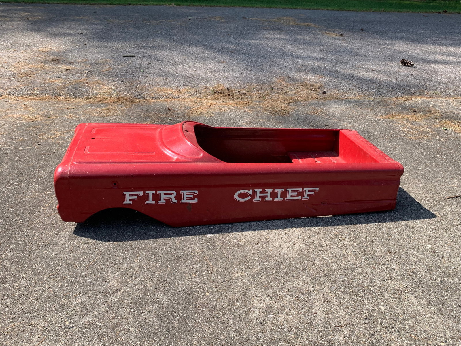 Vintage AMF Model 503 Fire Chief Pedal Car Body Shell: Attributed to AMF, this is a model 503 Fire Chief pedal car body shell from the 1960s. The unit is constructed from pressed steel and retains its original red finish with white decorative elements. On
