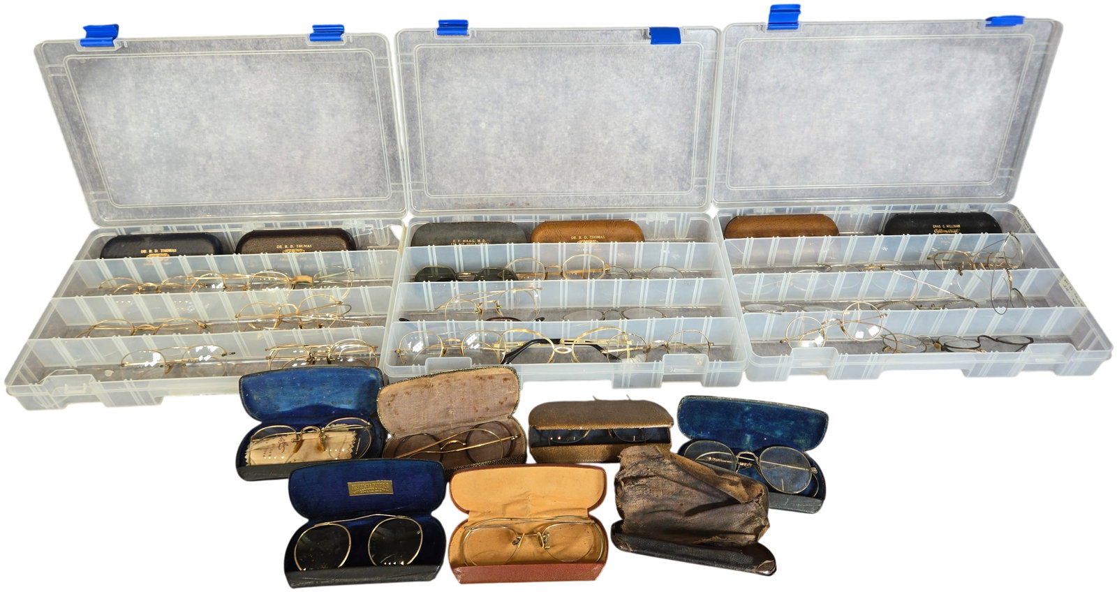 A Collection of Late 19th to Mid-20th Century Spectacles, Sunglasses, and Associated Optical Cases: This collection contains an assortment of historical eyewear and associated accessories primarily dating from the late 19th through the mid-20th century. The collection features a variety of frames, i