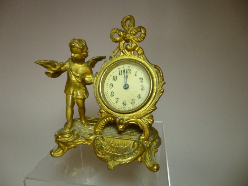 Antique Cherub Clock.: New Haven. 6” high. Shipping 12.