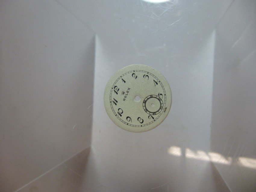 Small old Rolex watch dial.: 15/16” wide. Shipping 4.