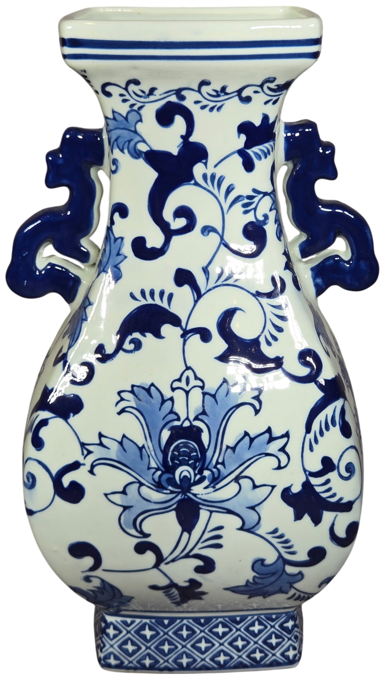 Vintage Chinese Blue and White Porcelain Quadrangular Vase: This vintage Chinese porcelain vase features a four-sided quadrangular form with a rectangular flared rim and a matching square foot. The neck is flanked by two applied blue-glazed handles modeled as 