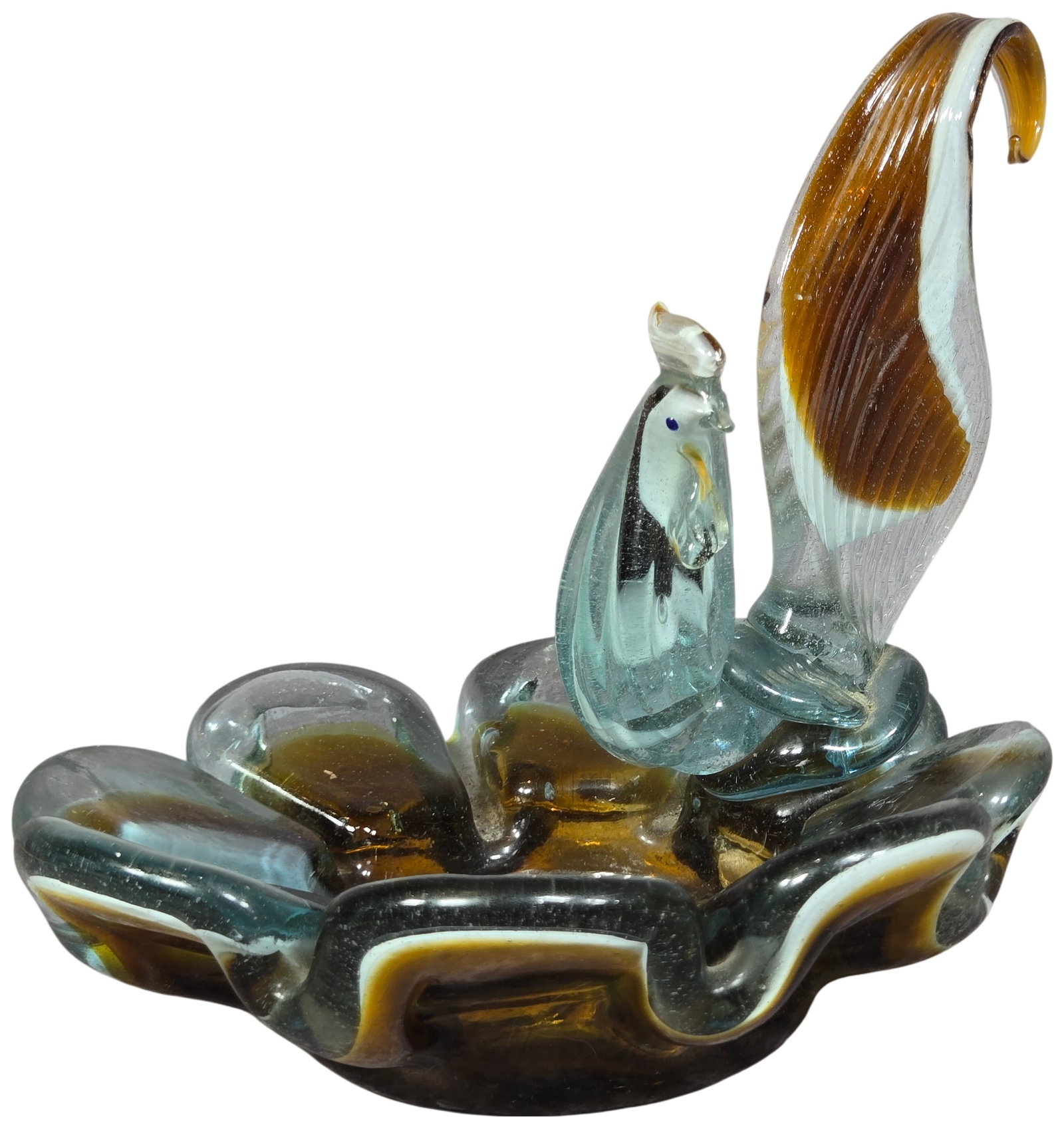 Mid-Century Murano Art Glass Sailfish Figural Dish: A mid-century hand-blown art glass figural dish featuring a stylized sailfish. The fish figure is integrated with a ruffled, seven-petaled flower-form base. The glass is clear with internal casing com