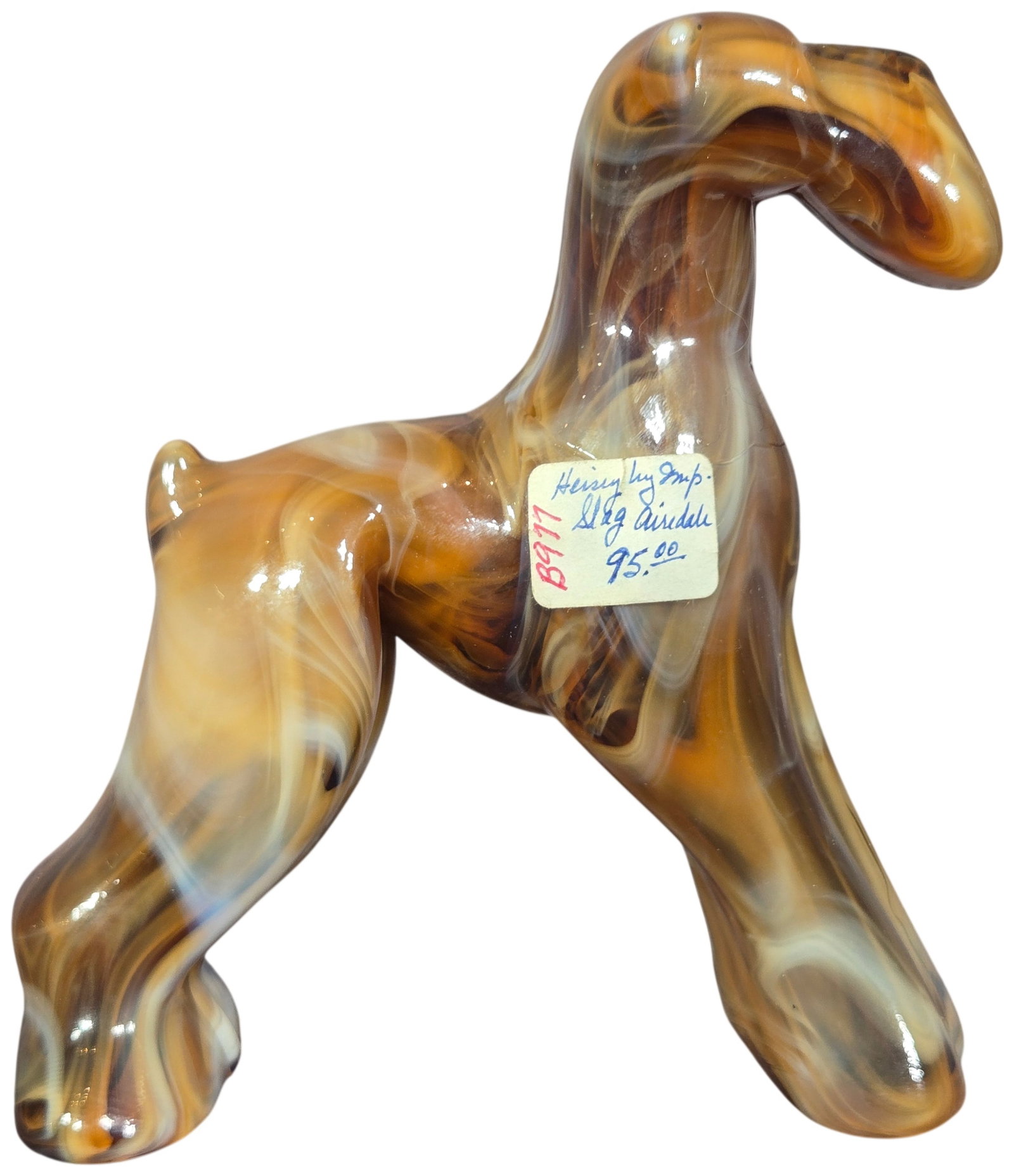 Imperial Glass Caramel Slag Airedale Terrier Dog Figurine: This figurine of an Airedale Terrier was produced by the Imperial Glass Company of Bellaire, Ohio, utilizing an original mold from the Heisey Glass Company. It is composed of caramel slag glass charac
