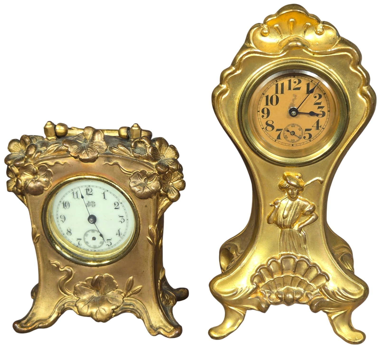 Two American Art Nouveau Gilt Metal Mantel Clocks by Benedict and Jennings Brothers: This lot includes two antique American Art Nouveau gilt metal mantel clocks. The larger clock was produced by the Benedict Manufacturing Co. in East Syracuse, New York. Its cast metal case features si