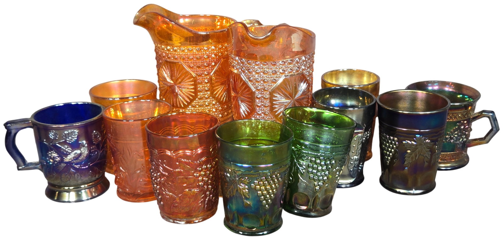 A Collection of Twelve Antique Carnival Glass Pitchers Mugs and Tumblers Including Northwood and (1 of 13)