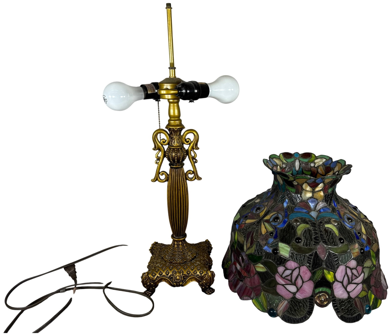 Leaded Glass Butterfly and Rose Motif Table Lamp with Gilded Cast Metal Base: This two-light table lamp features a leaded stained glass shade and an ornate cast metal base. The shade is decorated with a floral and insect motif consisting of pink and deep red roses, butterflies 