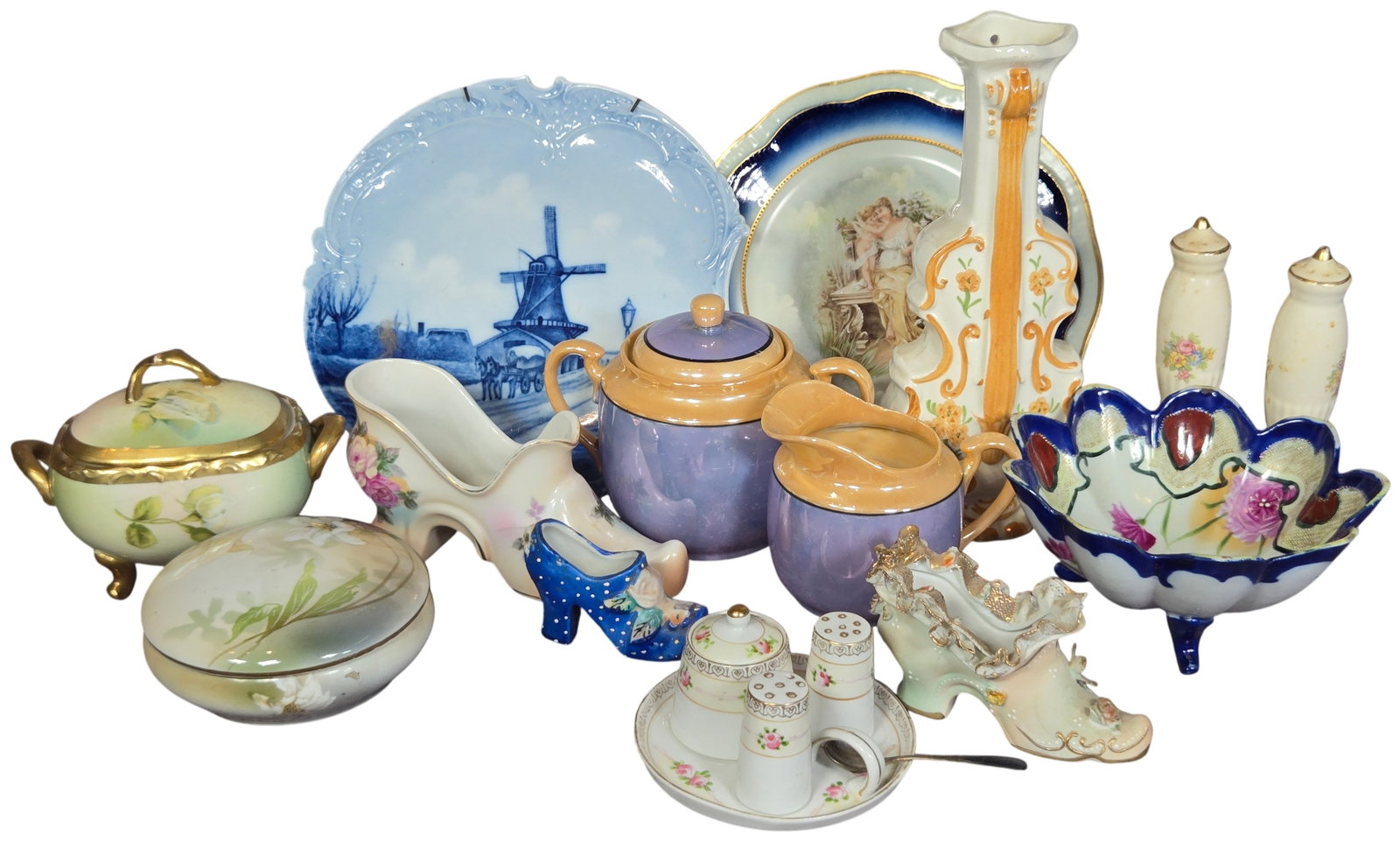 A Collection of Vintage Porcelain and Decorative Ceramics Including RS Germany and Nippon: This collection of thirteen decorative ceramic and porcelain items features pieces from German, Japanese, and American makers. The group includes a Reinhold Schlegelmilch (RS Germany) footed lidded di
