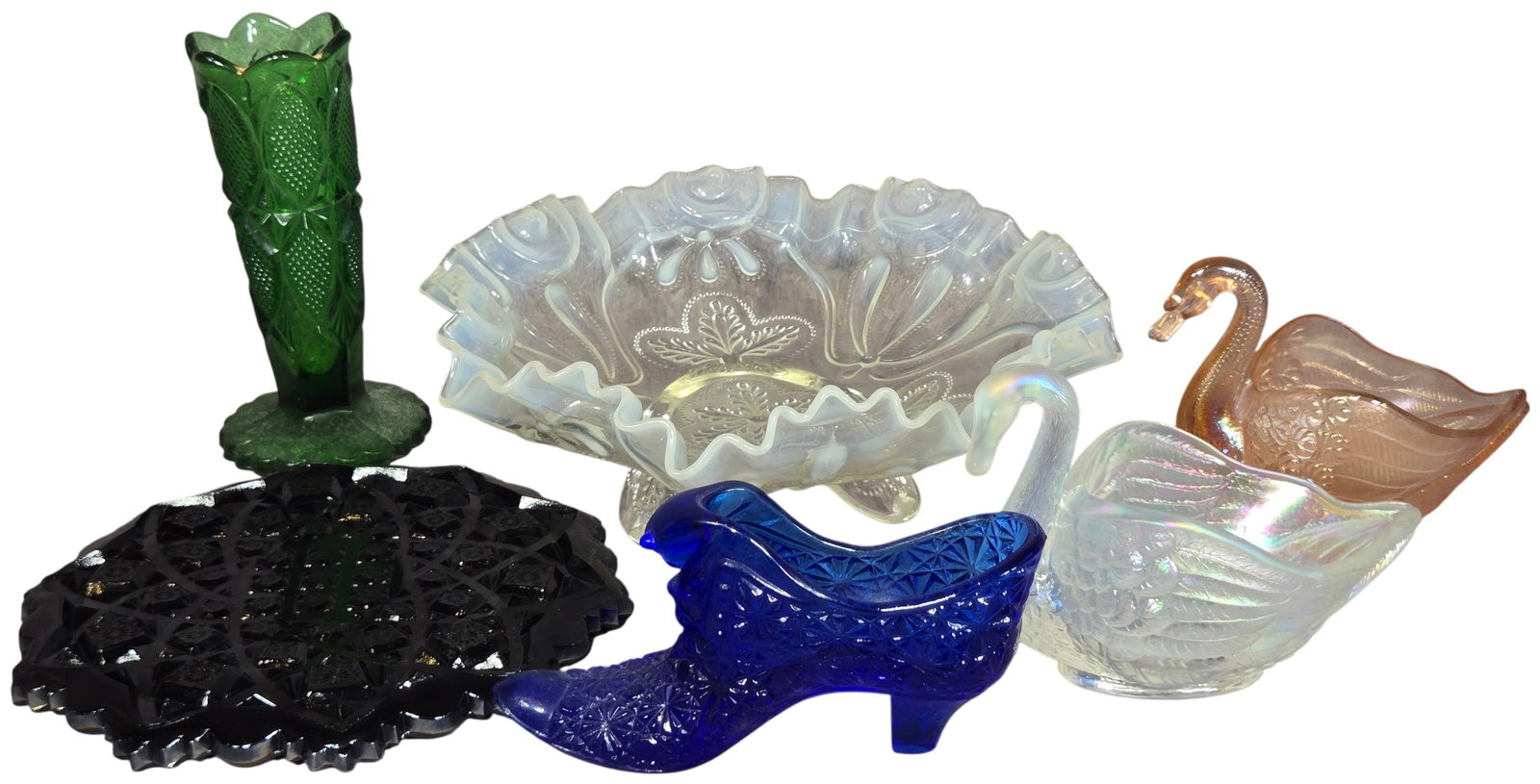 A Lot of Six Pieces of Vintage American Decorative Glass Featuring Northwood, Imperial, and: A lot of six pieces of vintage American decorative pressed and iridescent glassware in a variety of styles and colors. The collection includes a Northwood Strawberry pattern three-footed bowl in canar