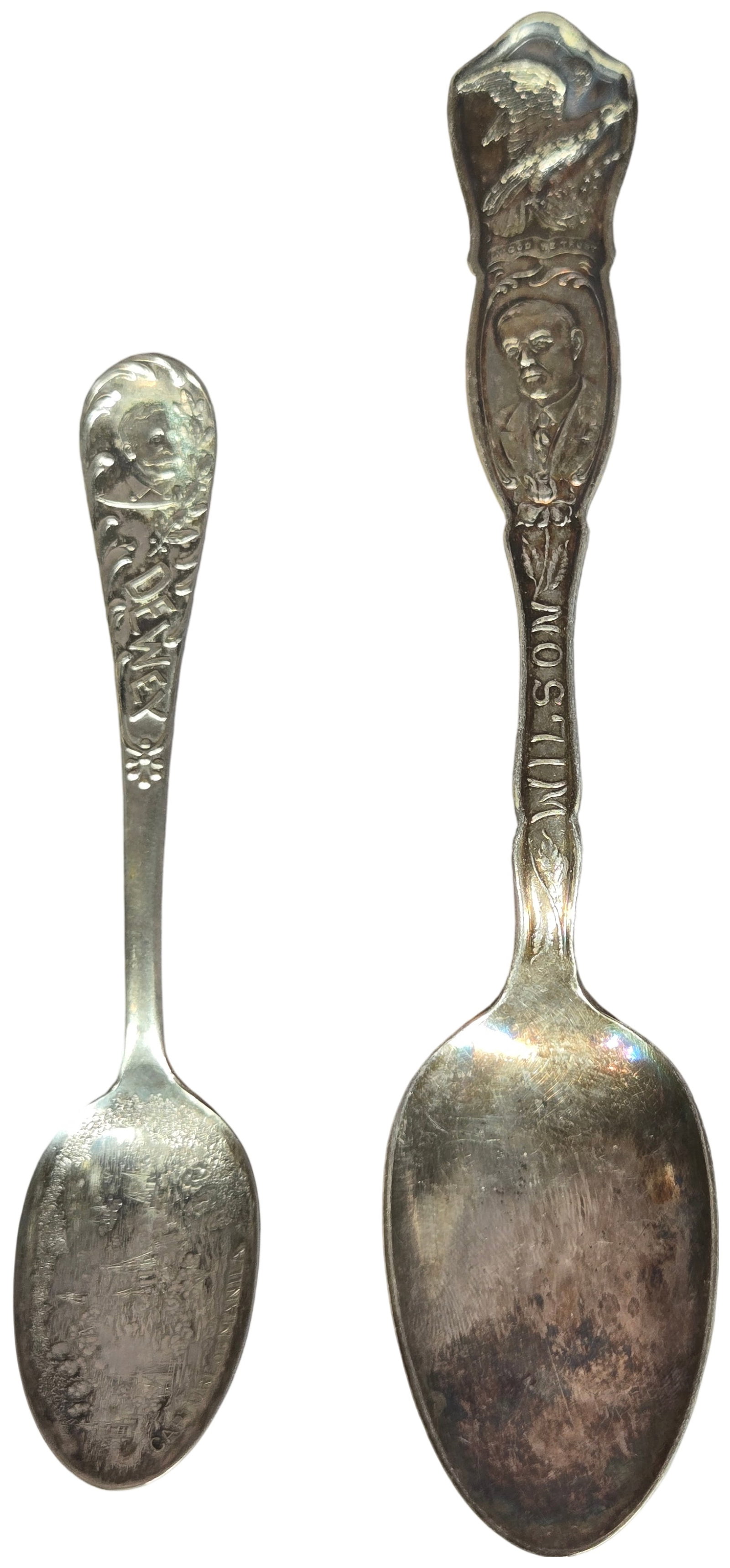 Two American Historical Commemorative Silver-Plated Souvenir Spoons: This lot features two American historical commemorative souvenir spoons constructed from silver-plated metal. The first item is a teaspoon commemorating Woodrow Wilson. The obverse handle terminal dis