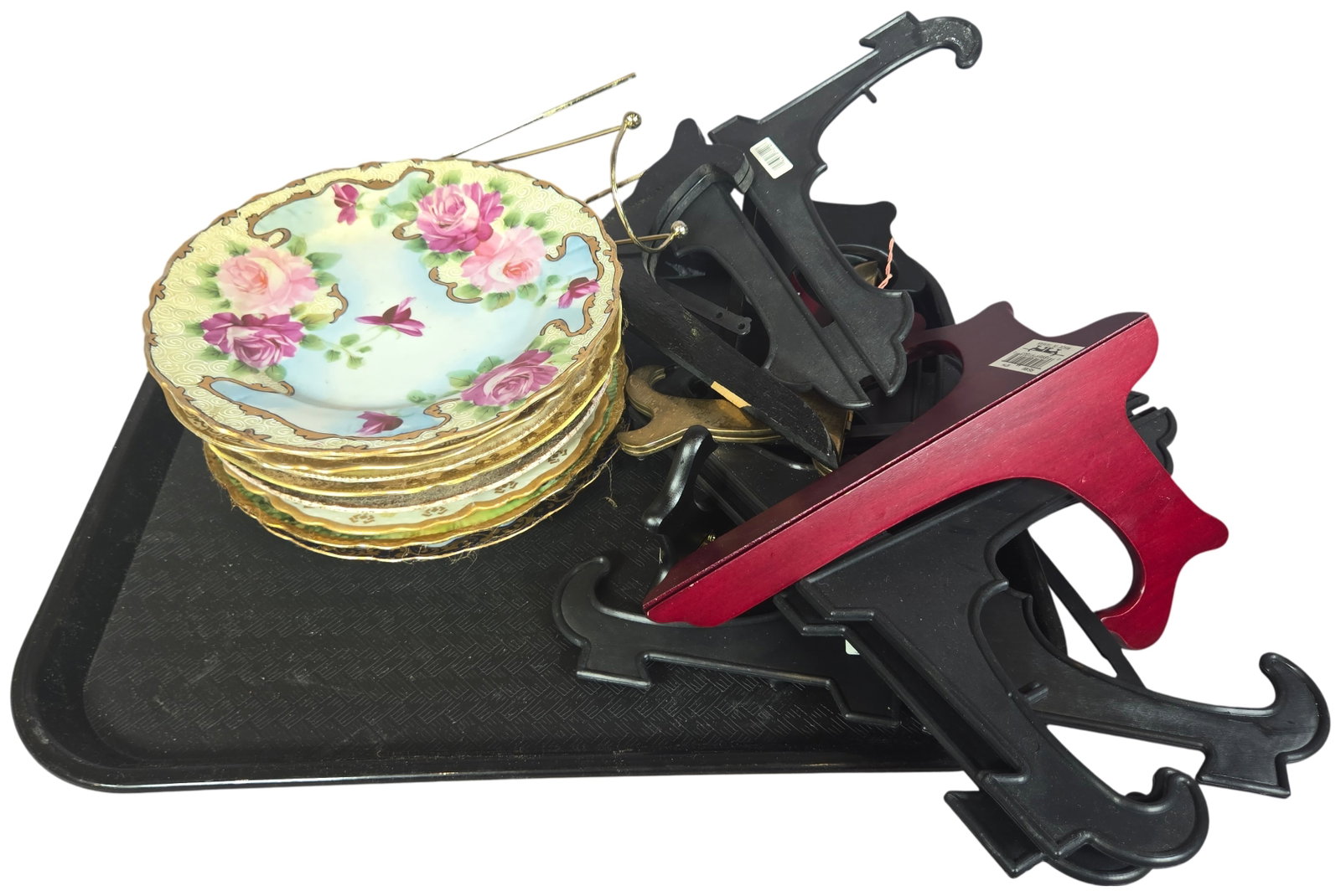 A Collection of Nine Assorted Hand Painted Porcelain Cabinet Plates and Twelve Display Stands: This lot comprises nine vintage porcelain cabinet and dessert plates featuring various hand-painted floral and botanical motifs. The collection includes plates with scalloped and gilded rims, some