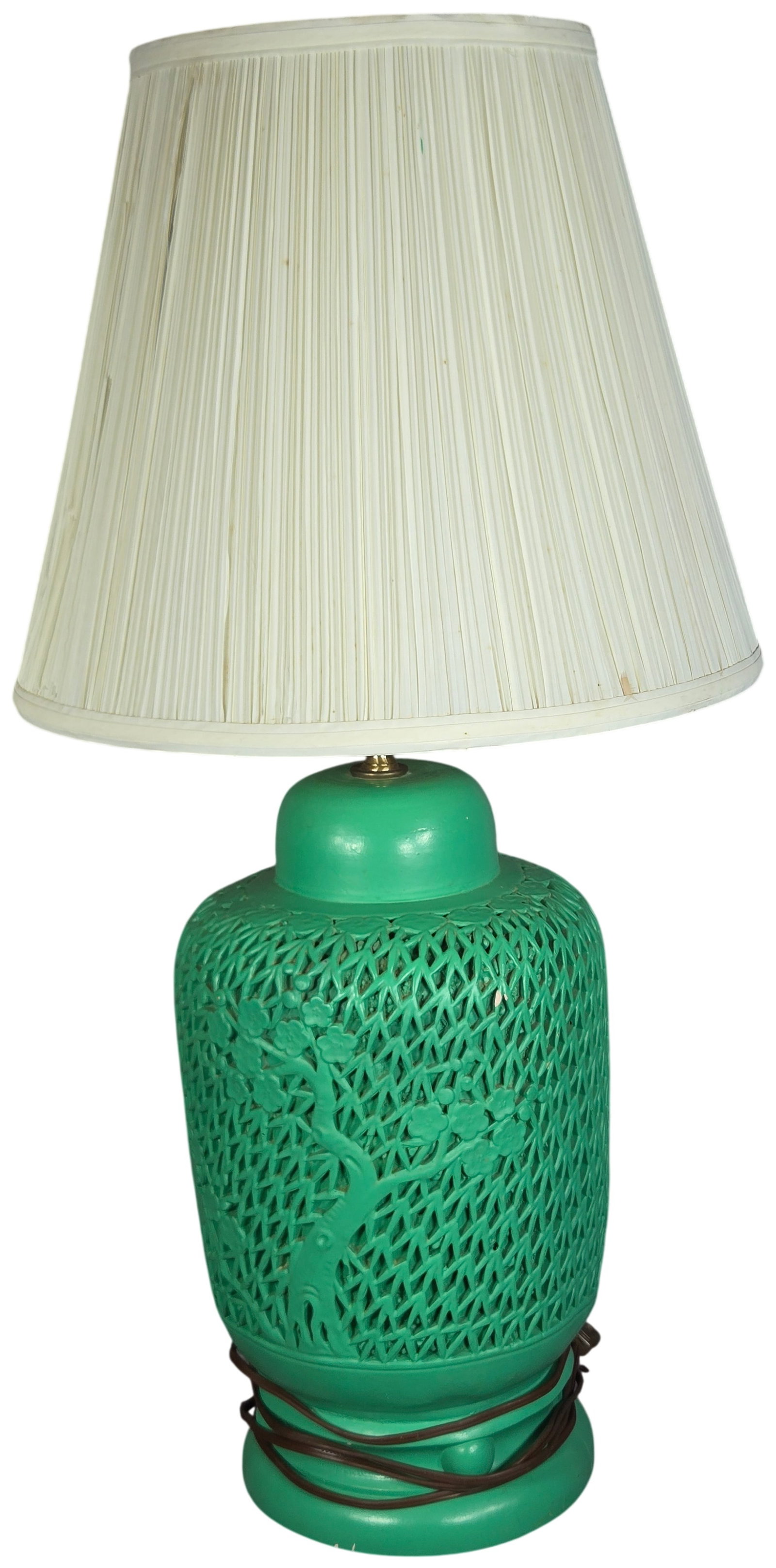 Mid-Century Chinoiserie Reticulated Green Ceramic Table Lamp: This vintage Chinoiserie-style table lamp features a vibrant green ceramic base with an intricate reticulated or openwork design. The base is decorated with raised relief motifs of plum blossoms and a