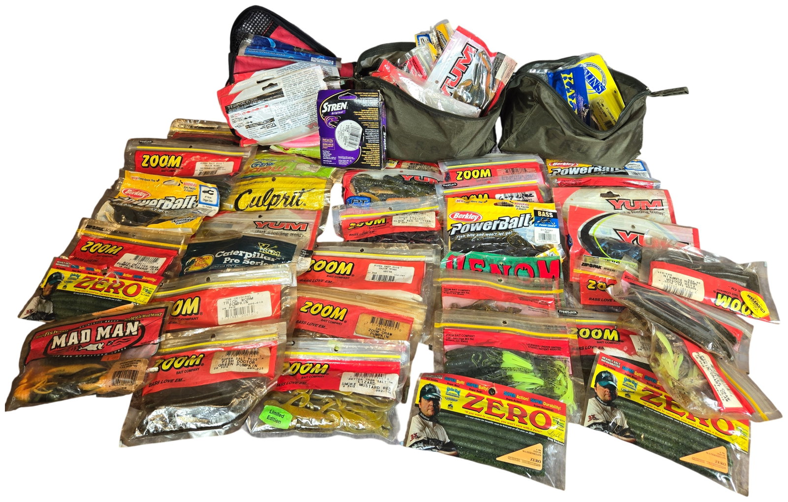 An Assortment of Bass Fishing Soft Plastic Lures, Stren Fishing Line, and Tackle Pouches: This collection features an assortment of soft plastic lures from various makers including Zoom Bait Company, YUM, Berkley PowerBait, Strike King, Kinami Baits, Culprit, Kalin's, Gene Larew, Mad Man, 