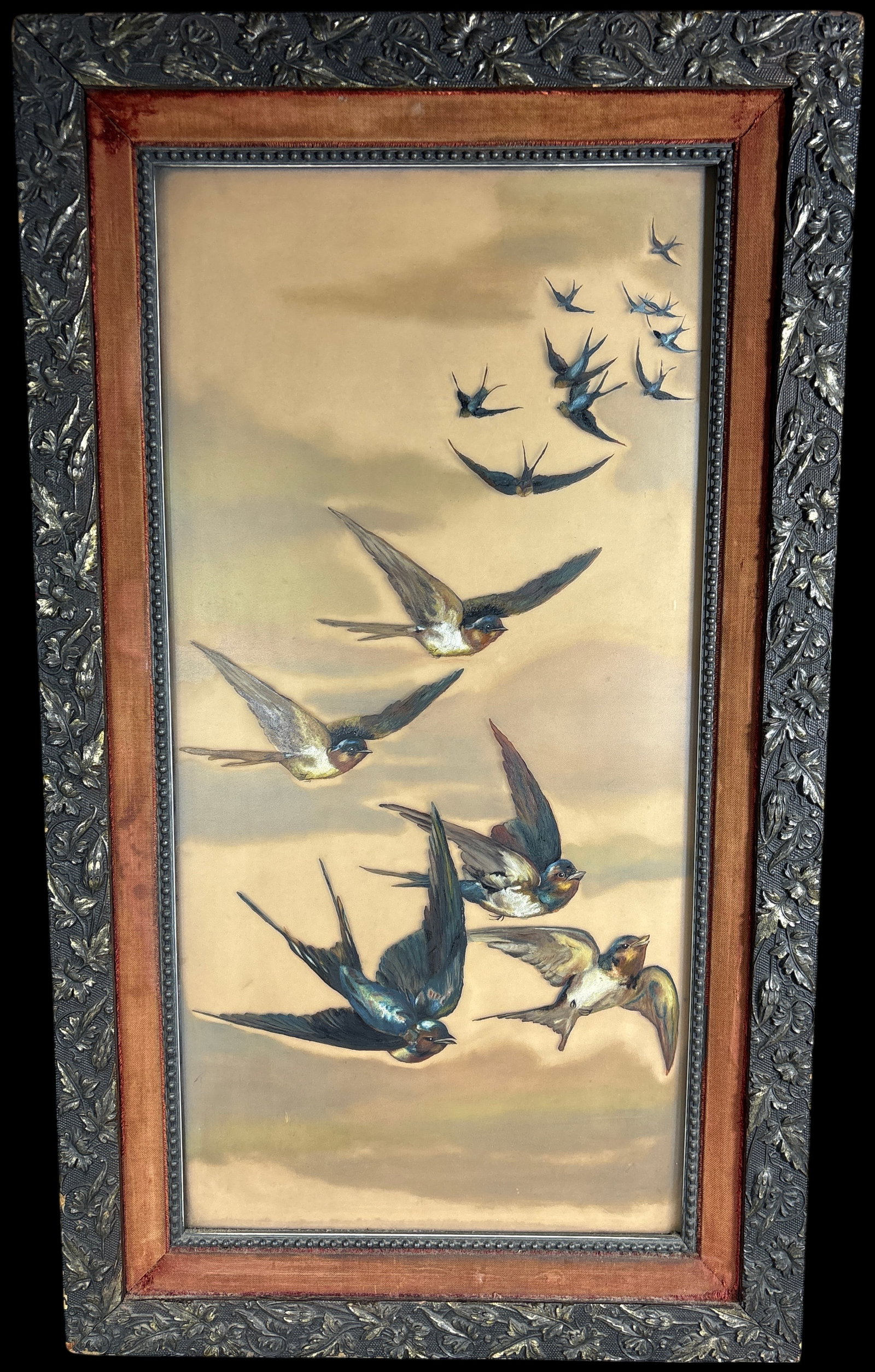 Victorian Mixed Media Relief Oil Paint on Glass Painting of Swallows in Flight: This Victorian-period mixed media artwork is executed in oil paint on glass and features a flock of barn swallows depicted in three-dimensional relief. The swallows are constructed from a molded compo