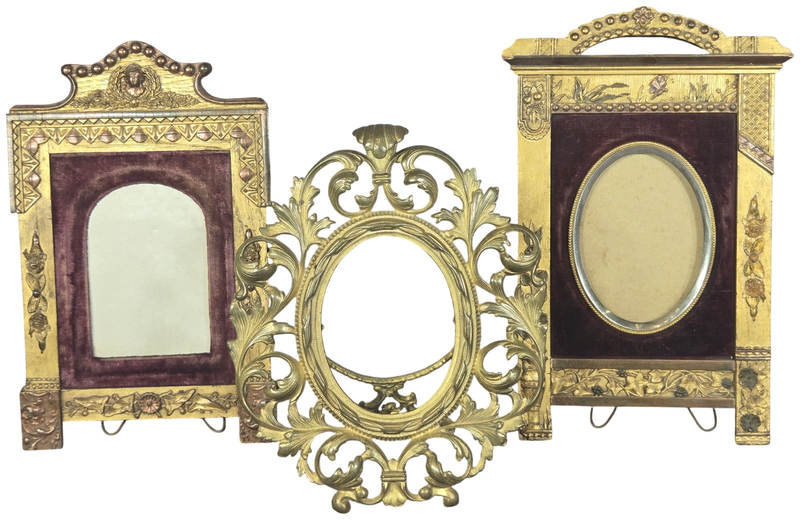 Three Victorian Aesthetic Movement and Rococo Revival Picture Frames: Three Victorian-era picture frames featuring Aesthetic Movement and Rococo Revival styles. The collection includes two rectangular gesso-over-wood frames and one ornate cast metal frame. The first fra