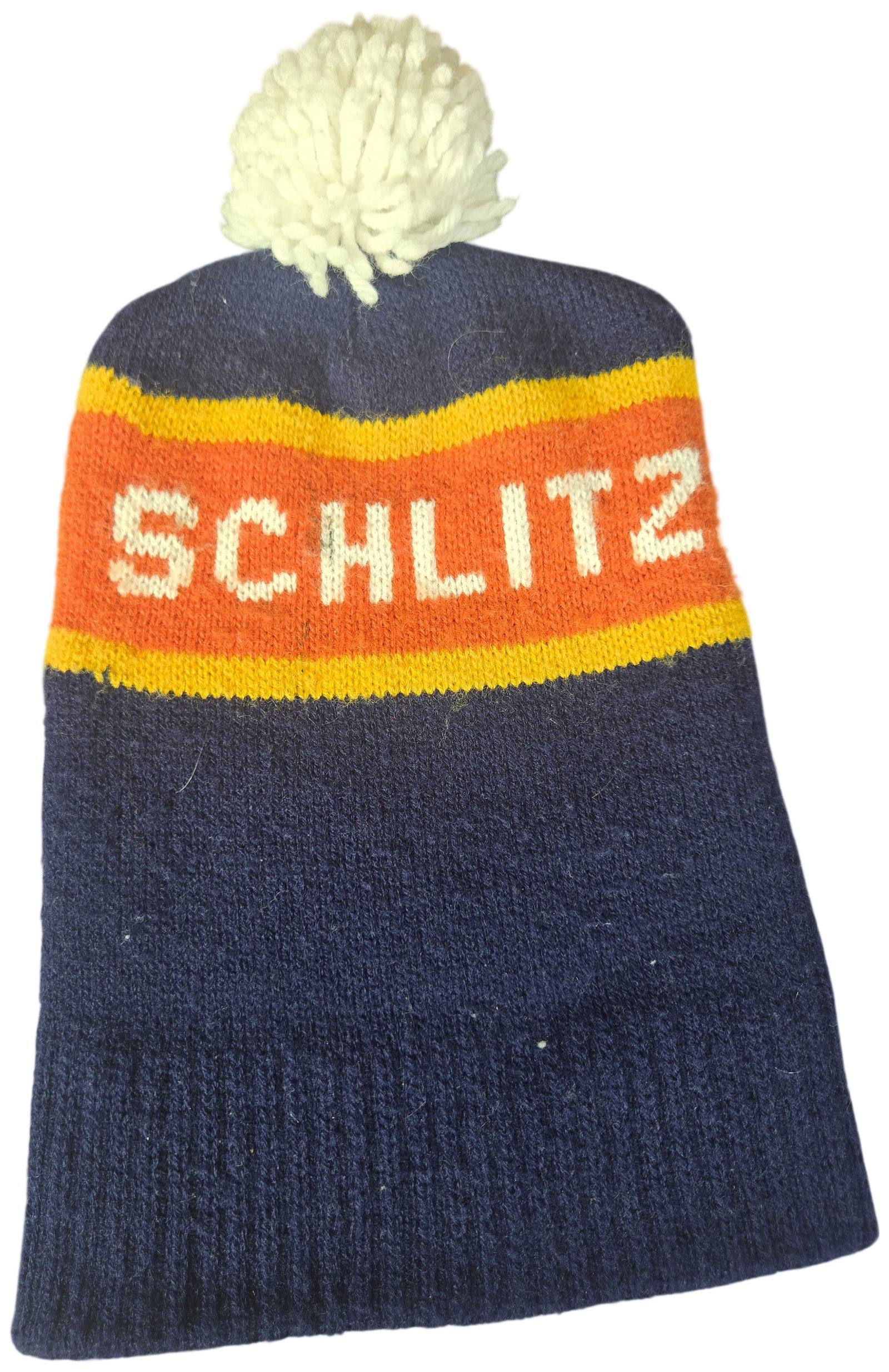 Vintage Schlitz Beer Promotional Knit Pom-Pom Stocking Cap: This is a vintage promotional knit stocking cap for the Joseph Schlitz Brewing Company, likely dating to the 1970s or 1980s. The hat is constructed from a navy blue knit textile, typically an acrylic 