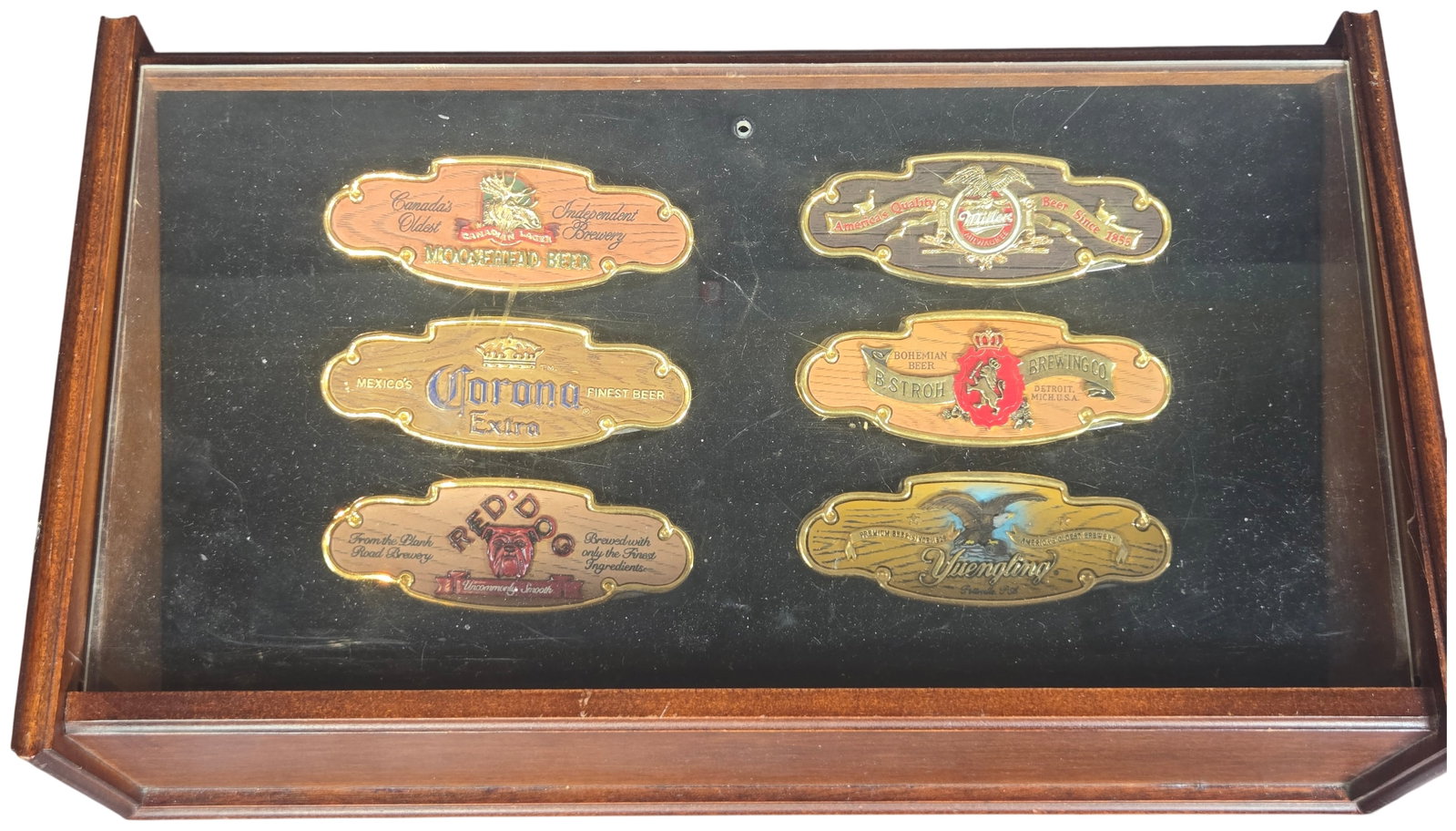 A Set of Franklin Mint World's Finest Brewing Companies Collector Knives in Display Case: A set of six themed folding pocket knives manufactured by Franklin Mint. The collection features prominent international brewery brands including Moosehead Beer, Miller, Corona Extra, B. Stroh Brewing