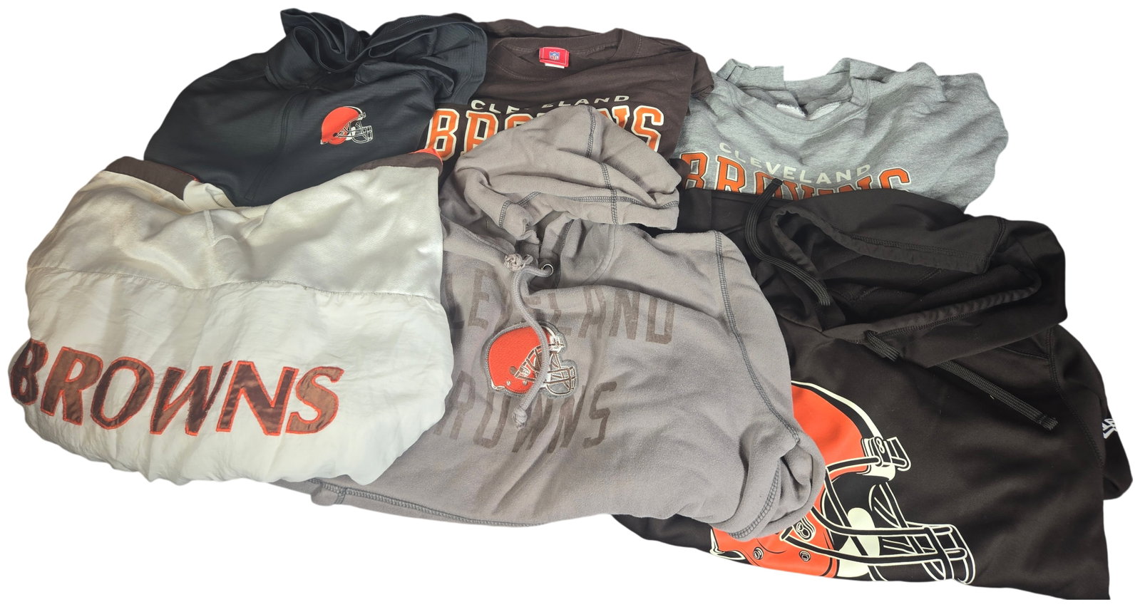 Six Assorted Cleveland Browns Apparel Items Including Nike, Starter, and '47 Brand: An assortment of six pieces of Cleveland Browns NFL fan apparel in various styles and brands. The lot includes a vintage Starter long-sleeved crewneck sweatshirt in white with brown shoulder panels an
