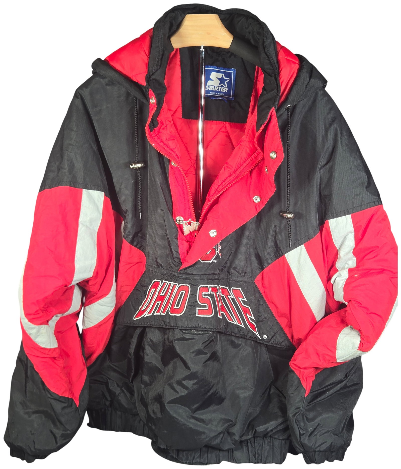 Vintage 1990s Ohio State Buckeyes Starter Hooded Pullover Padded Jacket Size XL: Vintage Starter brand hooded pullover jacket for the Ohio State Buckeyes. This heavy windbreaker style jacket features a black, red, and white color block design. It is constructed with a 100% nylon s